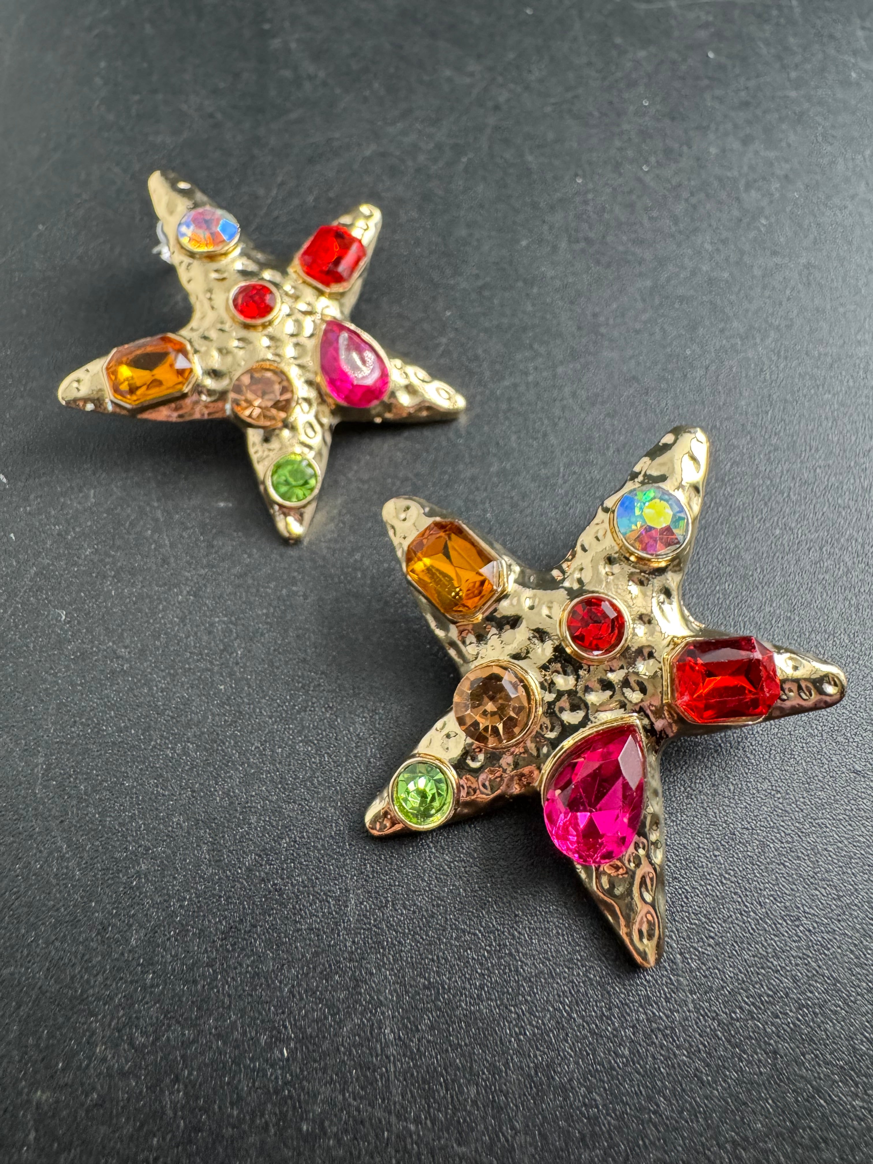 Oversized gold starfish earrings set with rainbow crystals, nautical jewellery