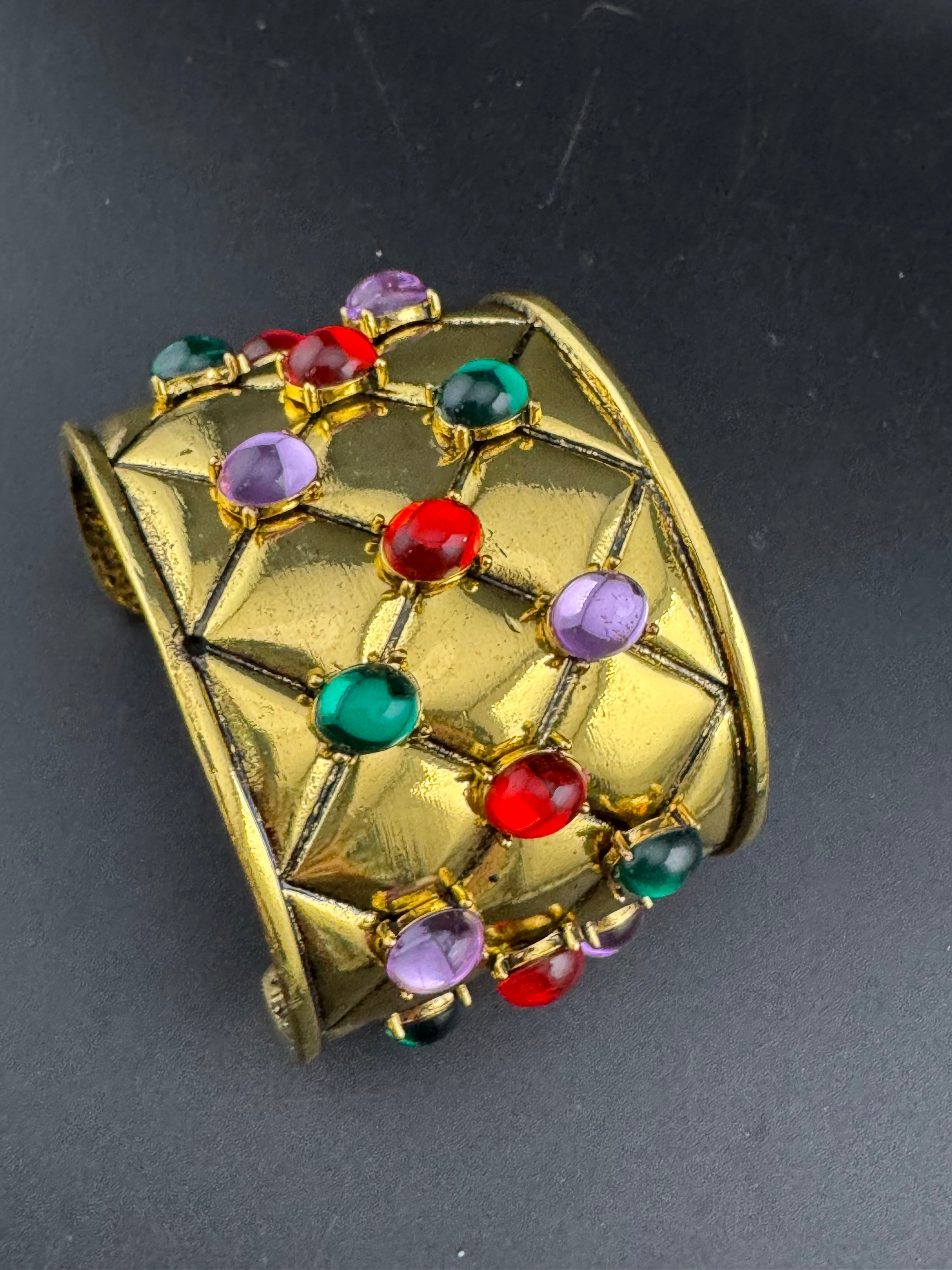 Etruscan style oversized open wide gold metal cushion cuff bangle with purple green red oval cabochons, medieval vibes