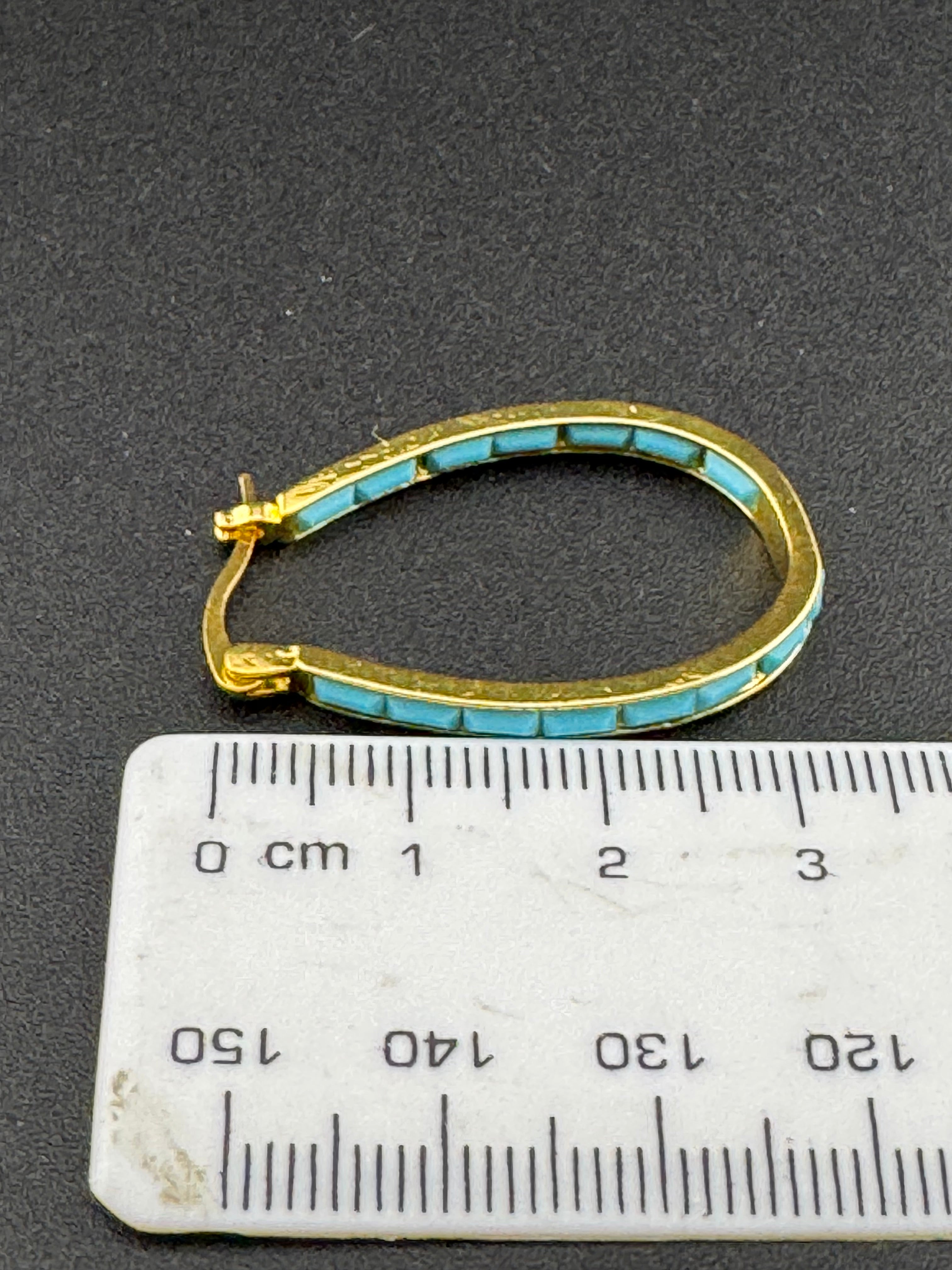 Turquoise blue gold tone oval hoop earrings