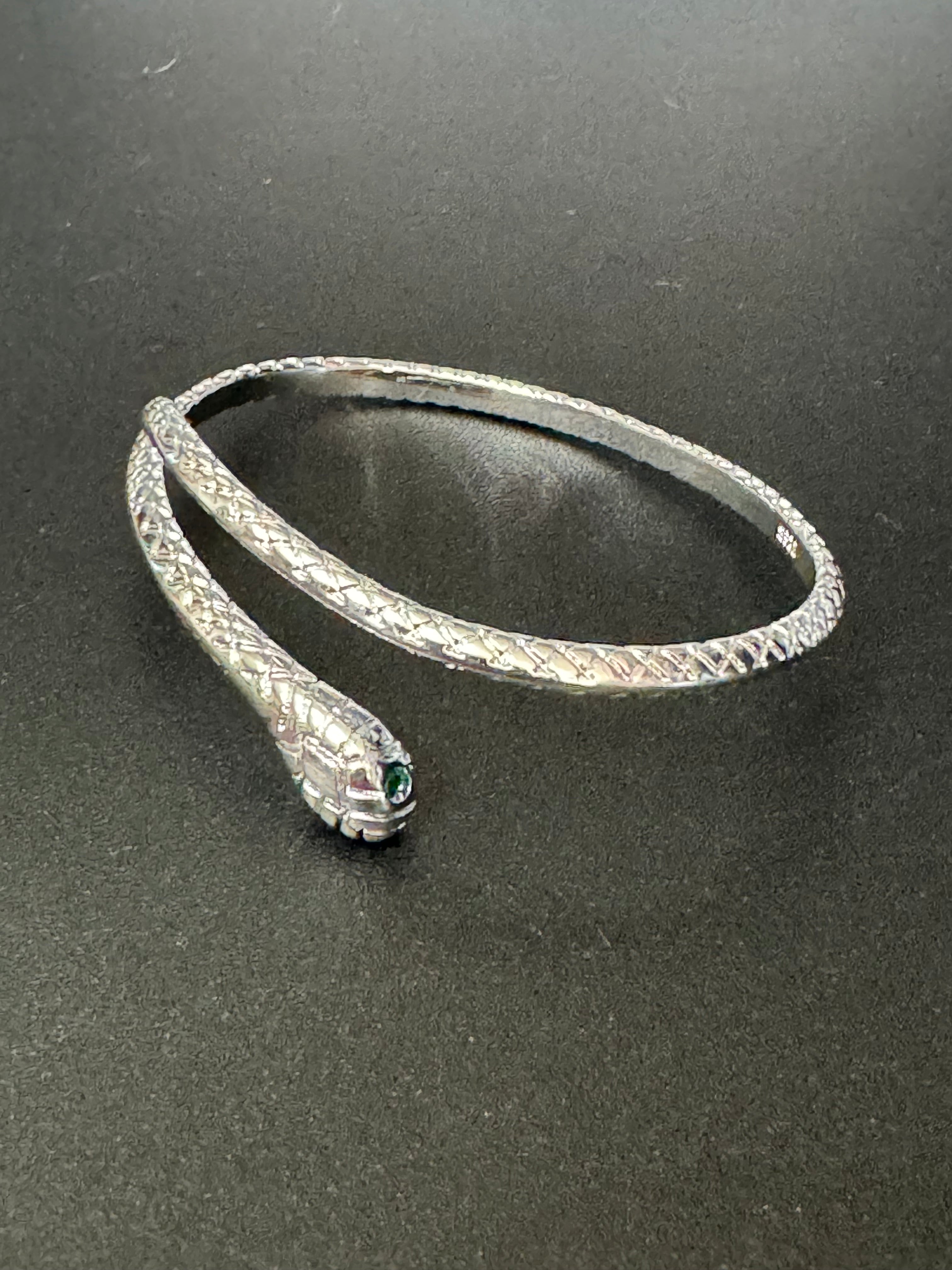 Silver plated snake bracelet with emerald eyes