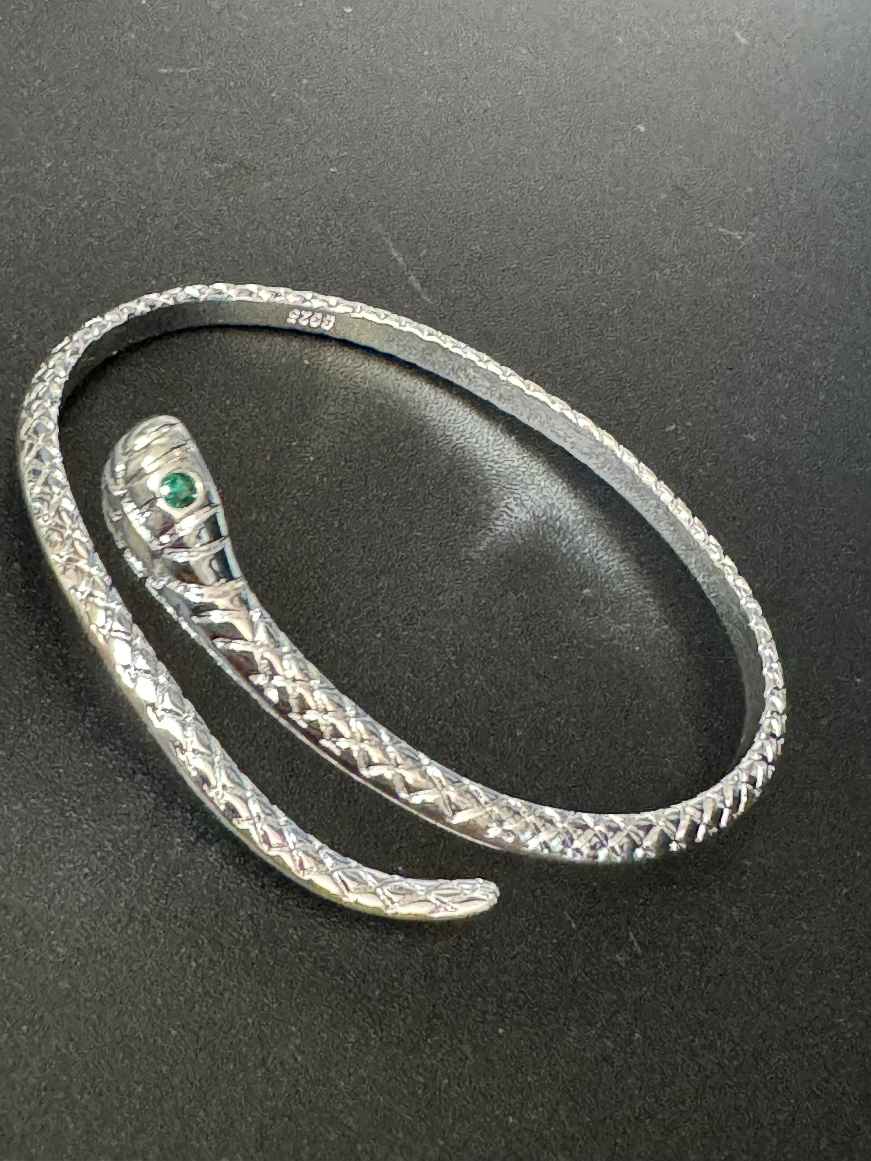 Silver plated snake bracelet with emerald eyes