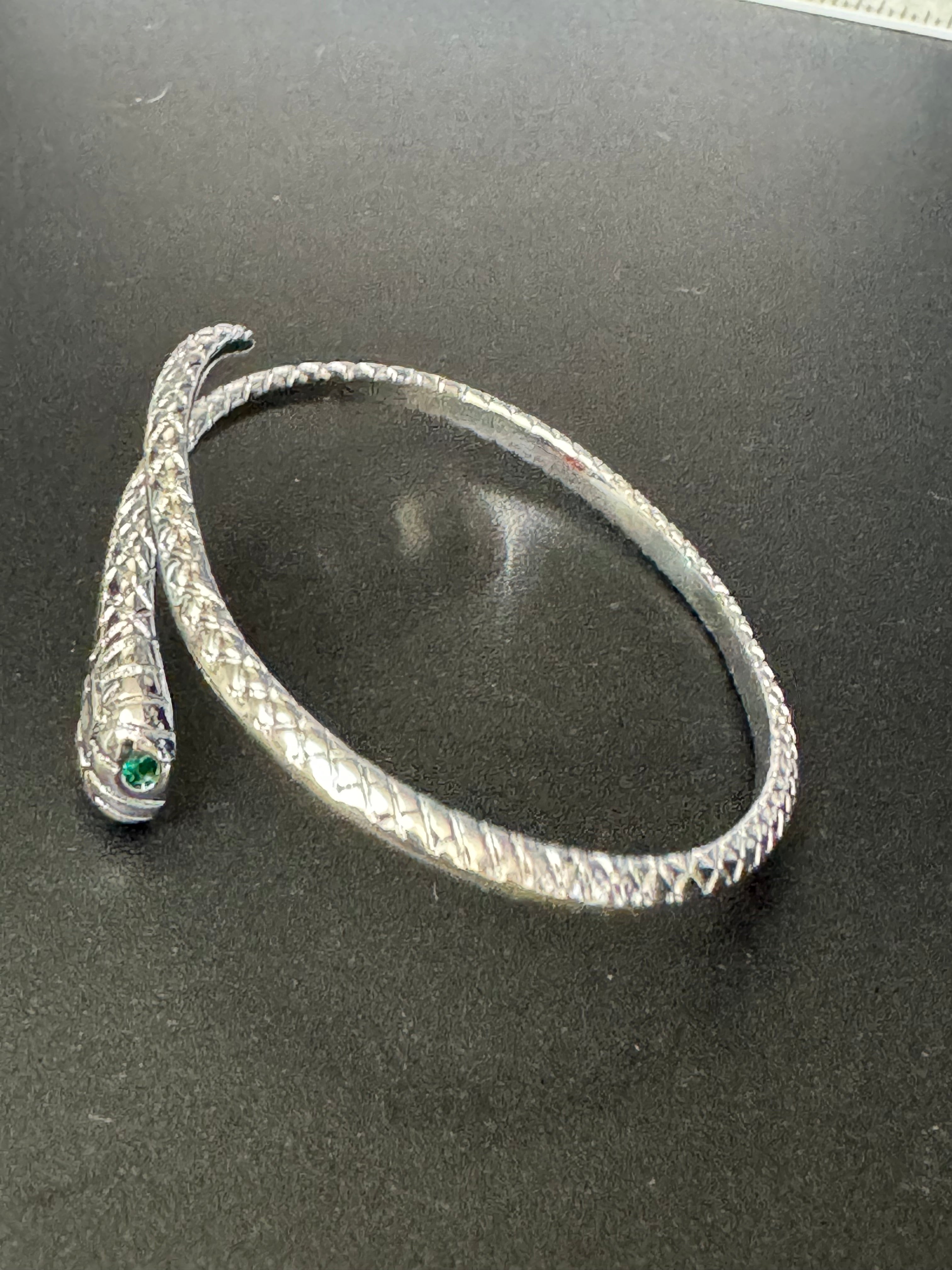 Silver plated snake bracelet with emerald eyes