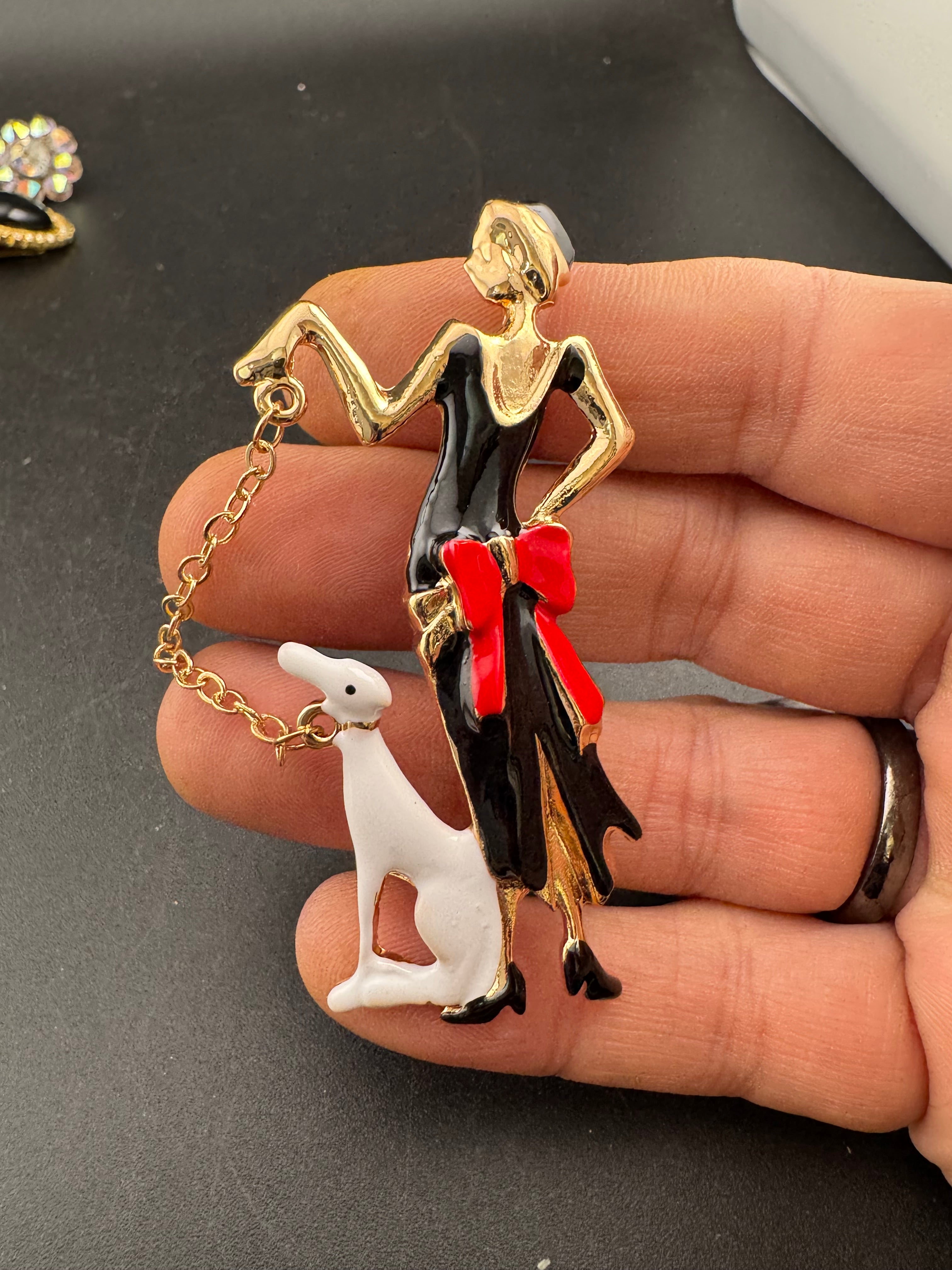 art deco lady with a dog on a lead brooch