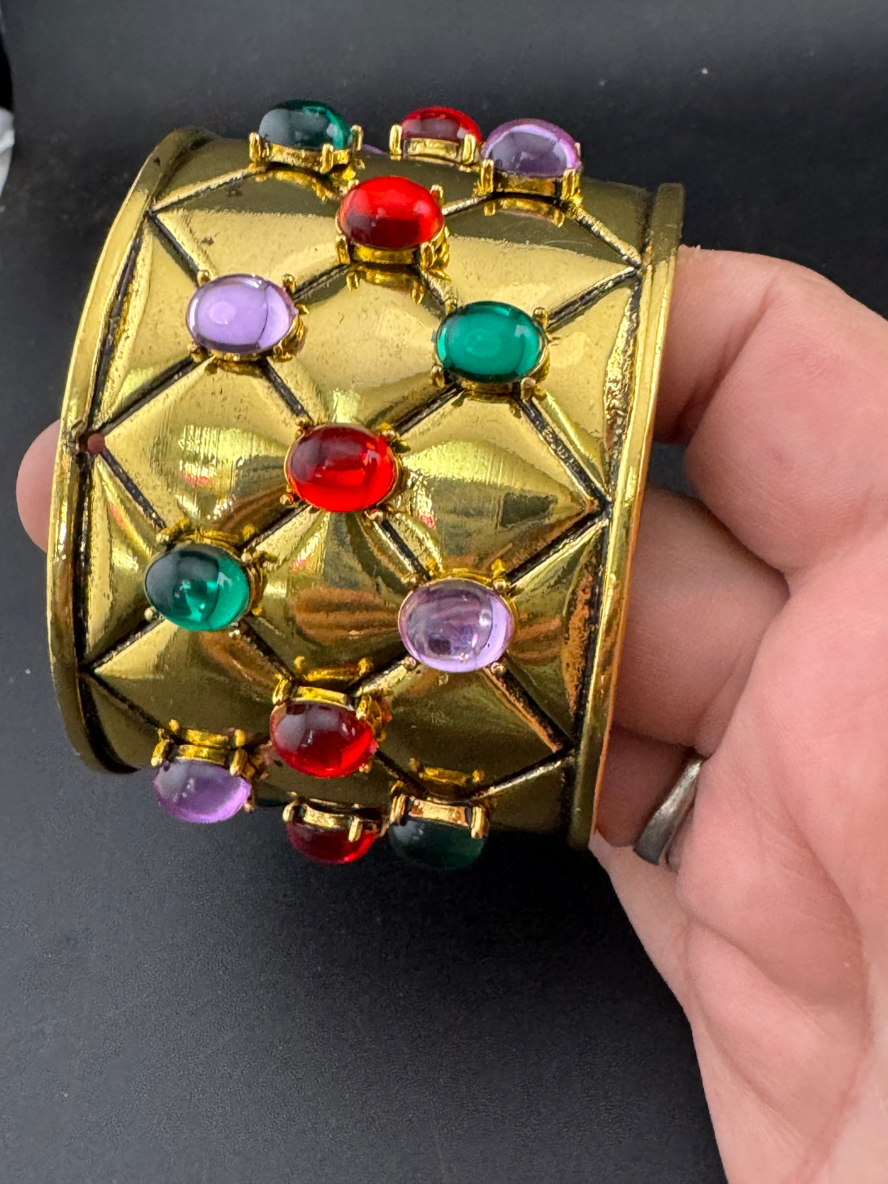 Etruscan style oversized open wide gold metal cushion cuff bangle with purple green red oval cabochons, medieval vibes