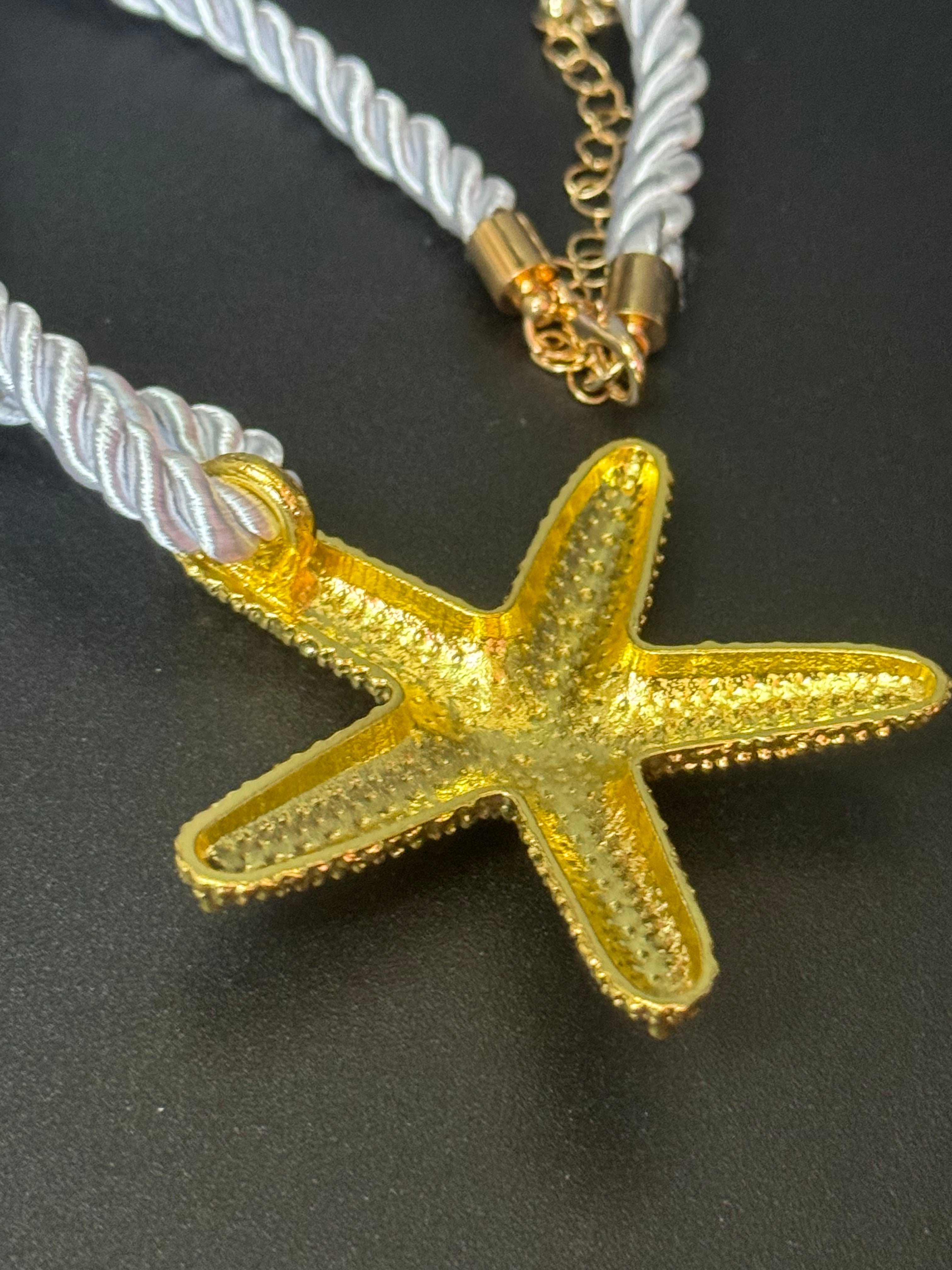 Big gold tone starfish nautical shell necklace on white cord