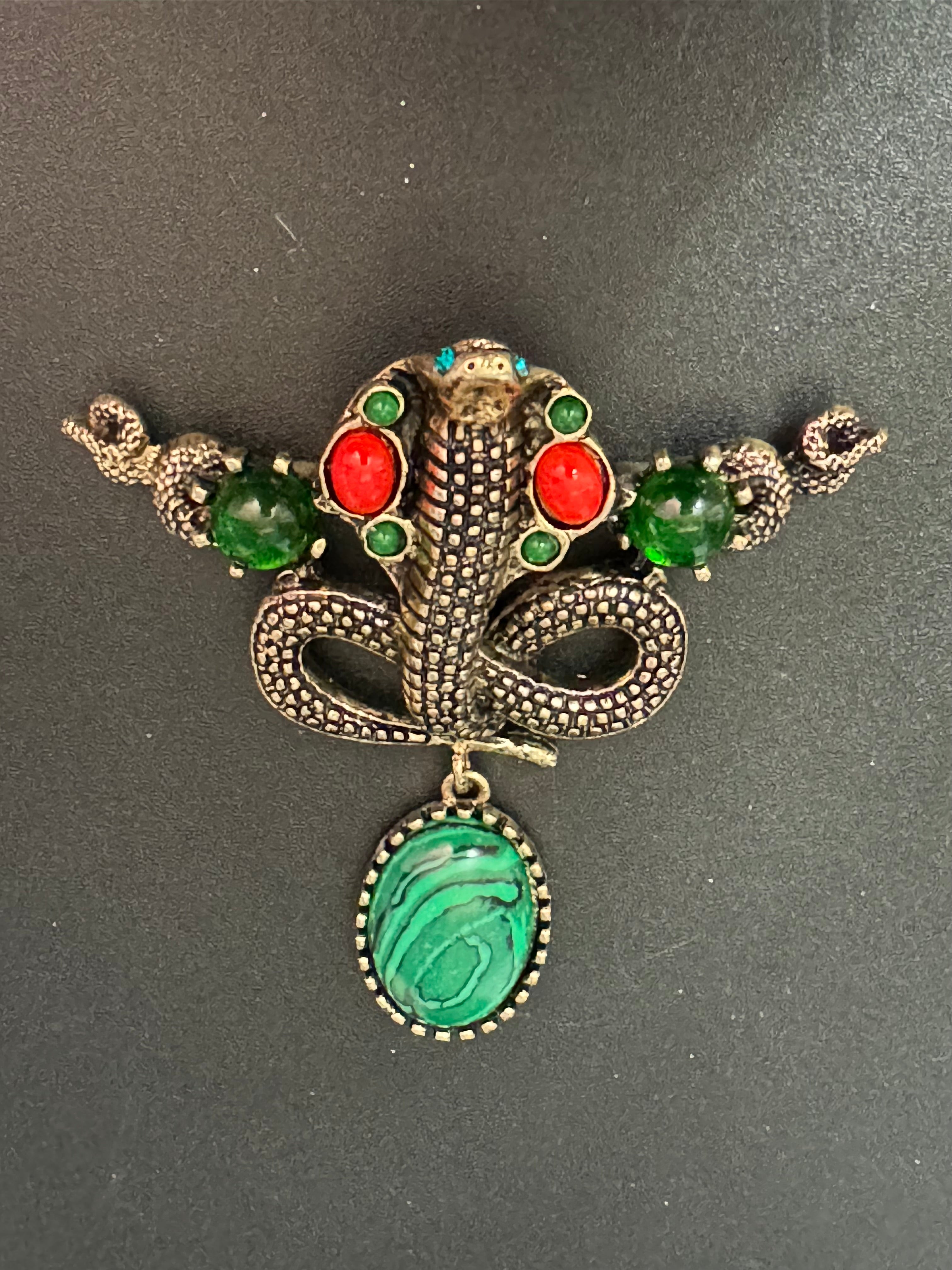 Oversized gold snake brooch with dropper and gemstones