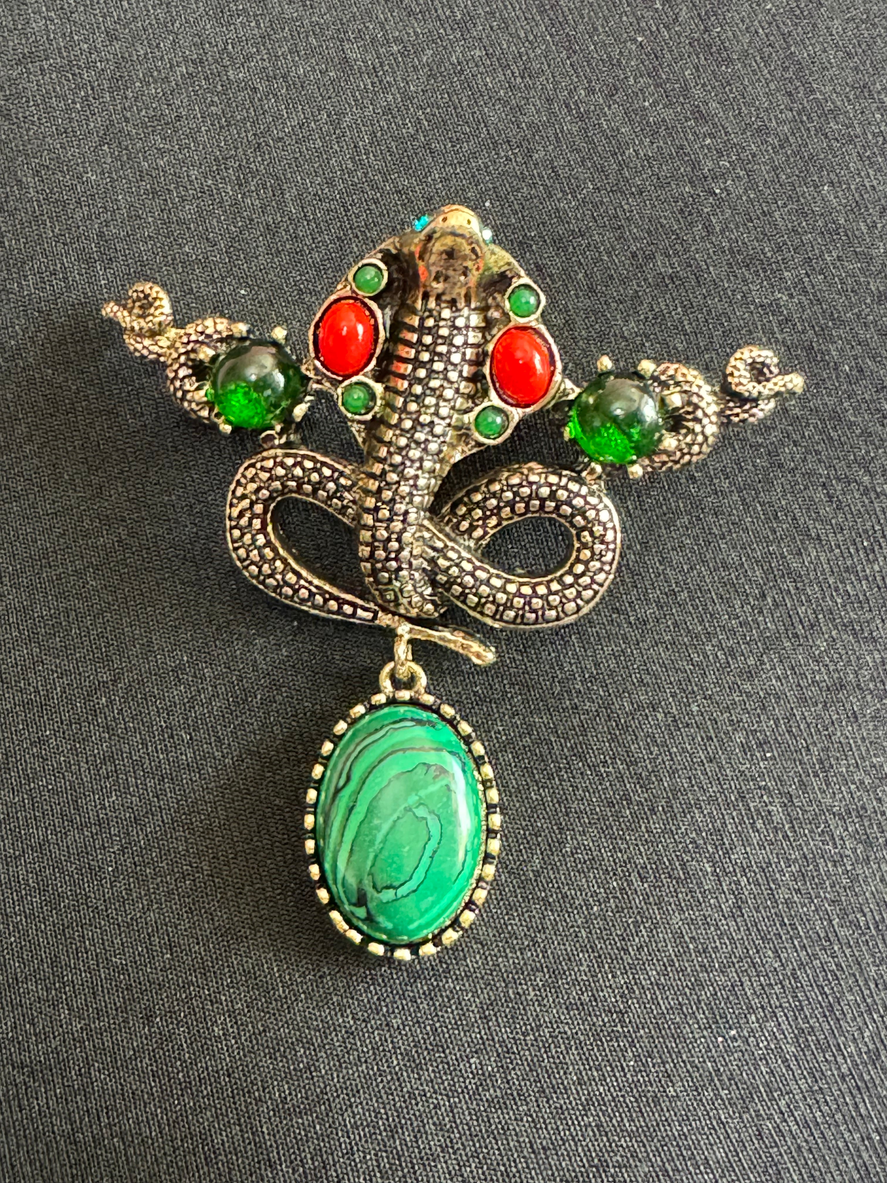 Oversized gold snake brooch with dropper and gemstones