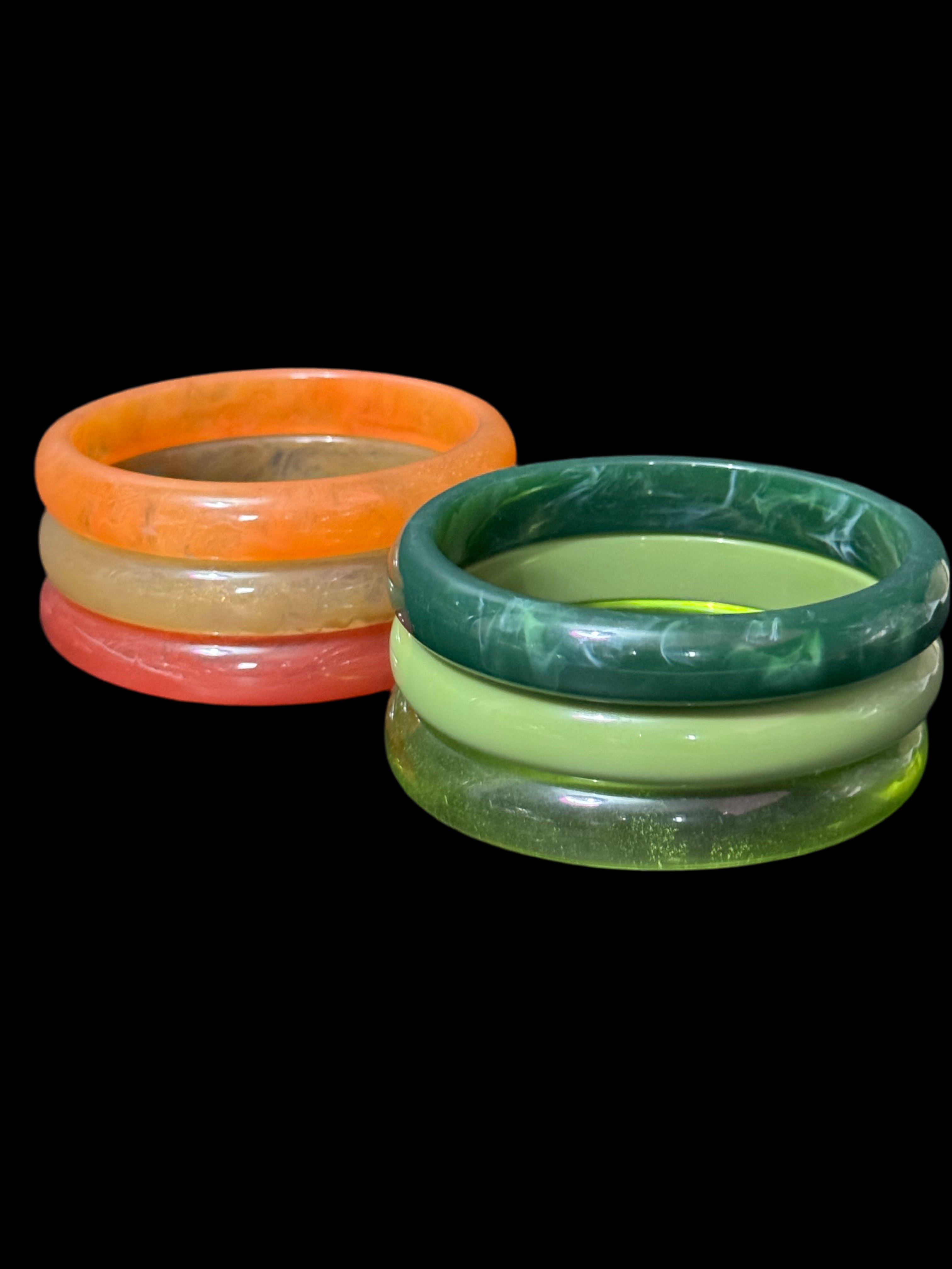 A trio of either orange or green tones mix and match acrylic bangles