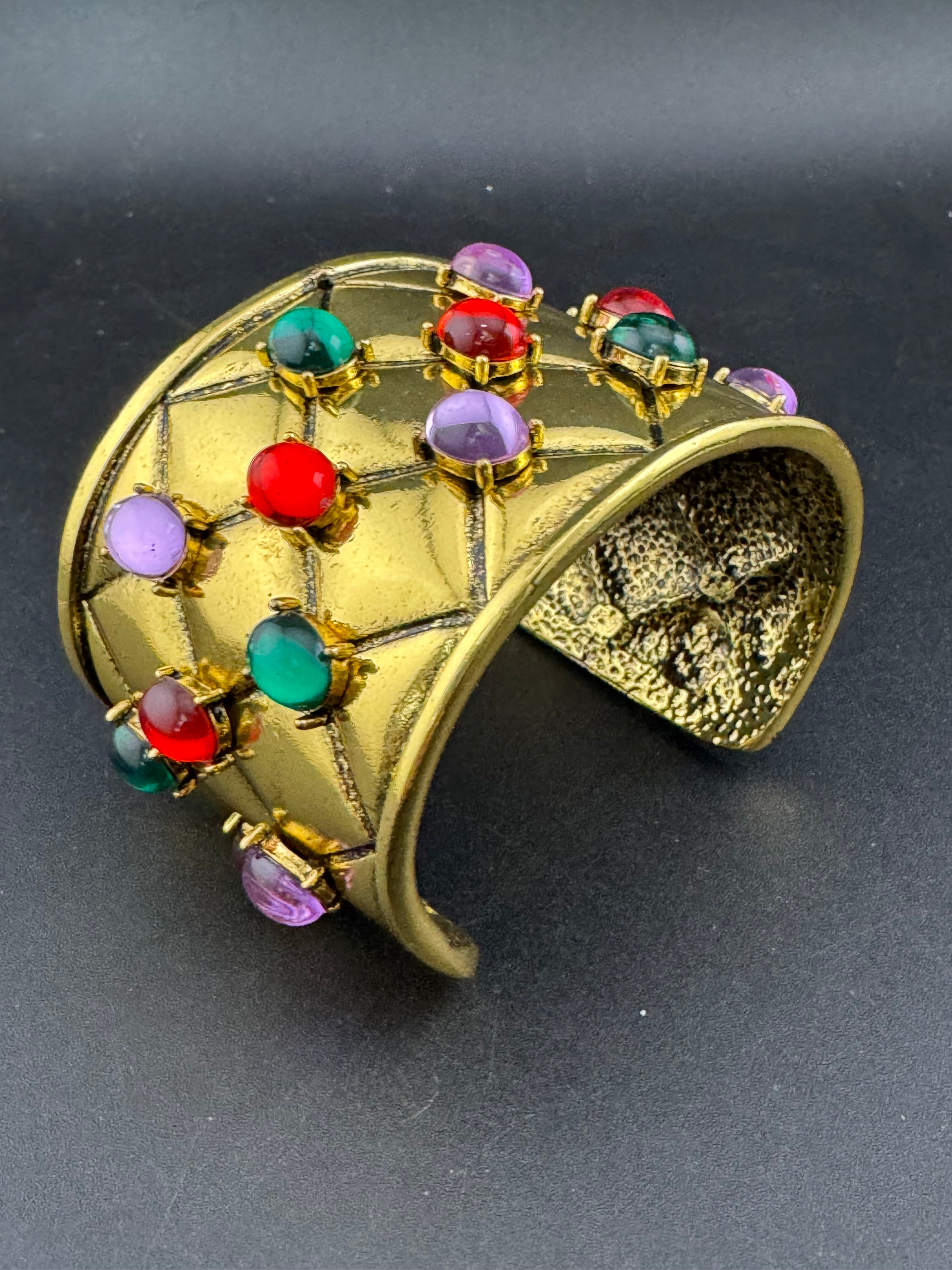 Etruscan style oversized open wide gold metal cushion cuff bangle with purple green red oval cabochons, medieval vibes