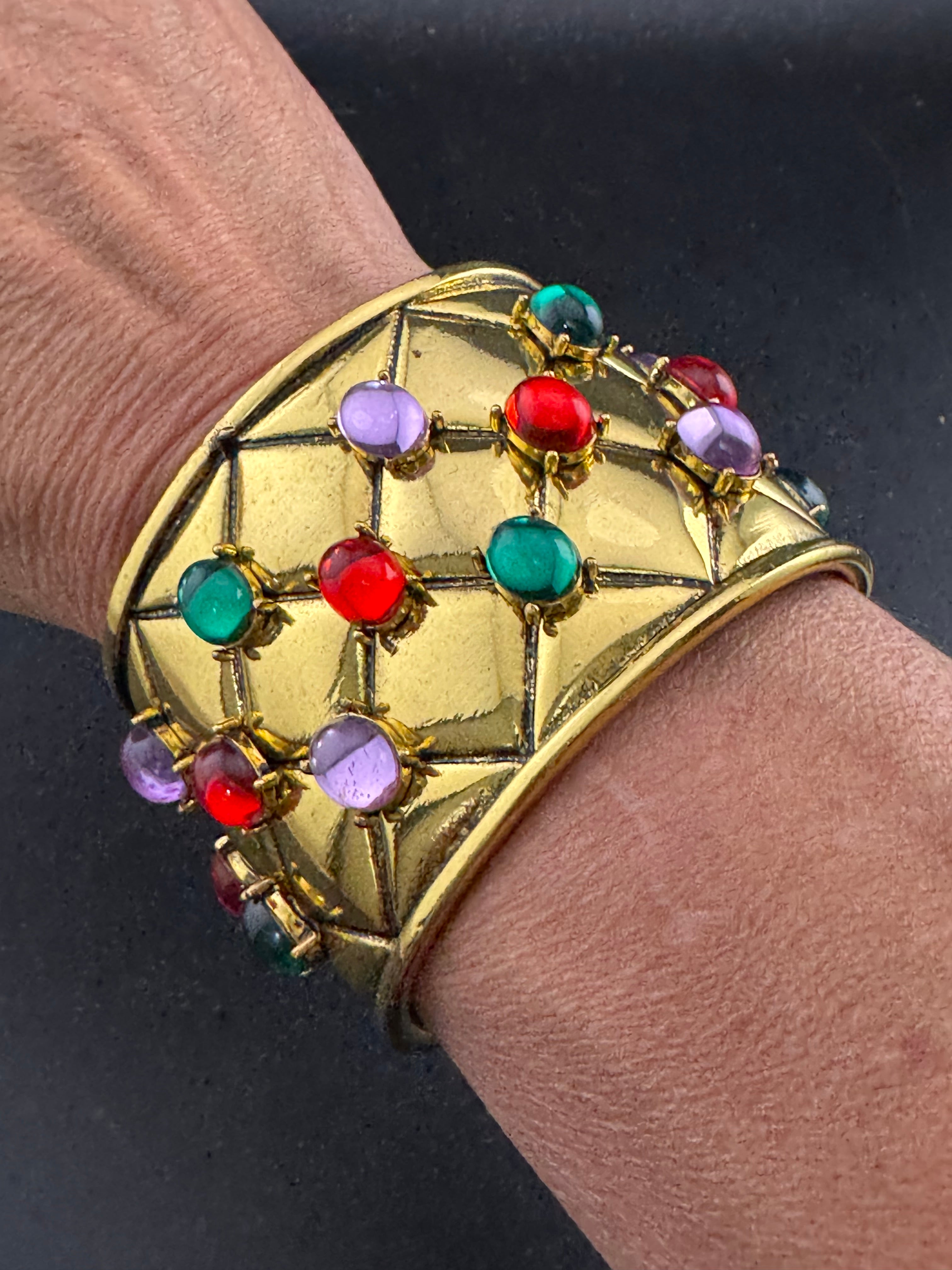 Etruscan style oversized open wide gold metal cushion cuff bangle with purple green red oval cabochons, medieval vibes