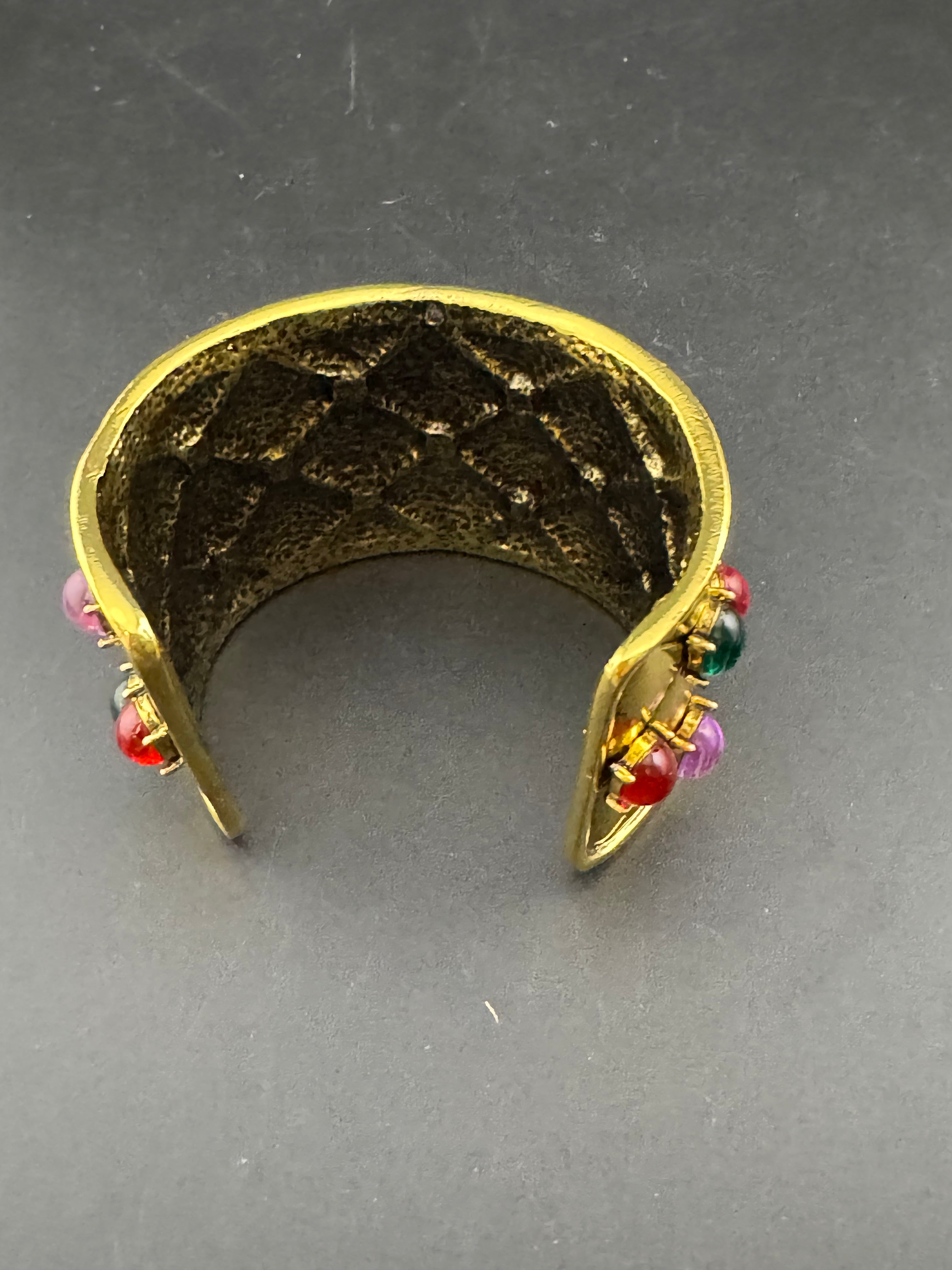 Etruscan style oversized open wide gold metal cushion cuff bangle with purple green red oval cabochons, medieval vibes