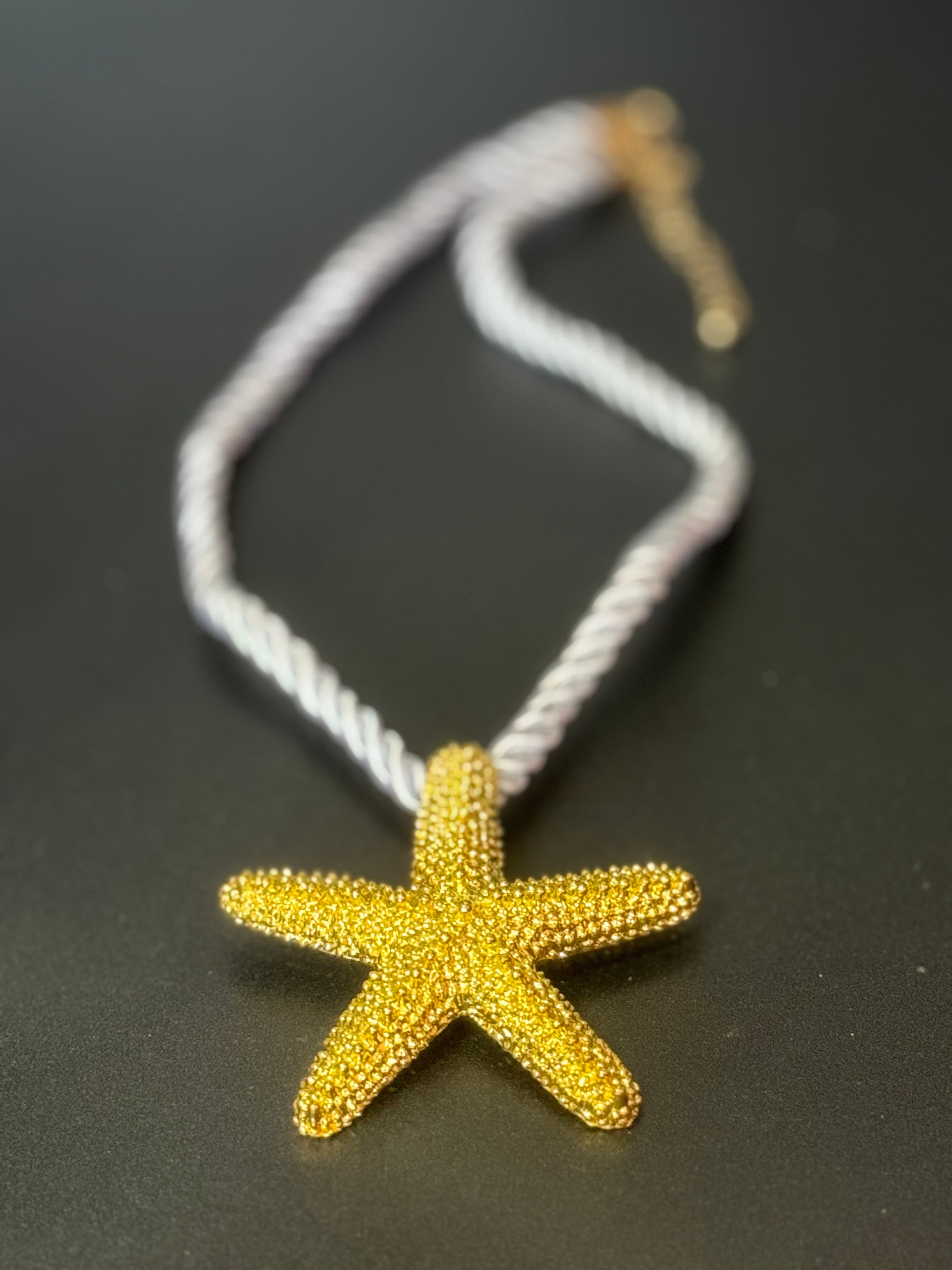 Big gold tone starfish nautical shell necklace on white cord