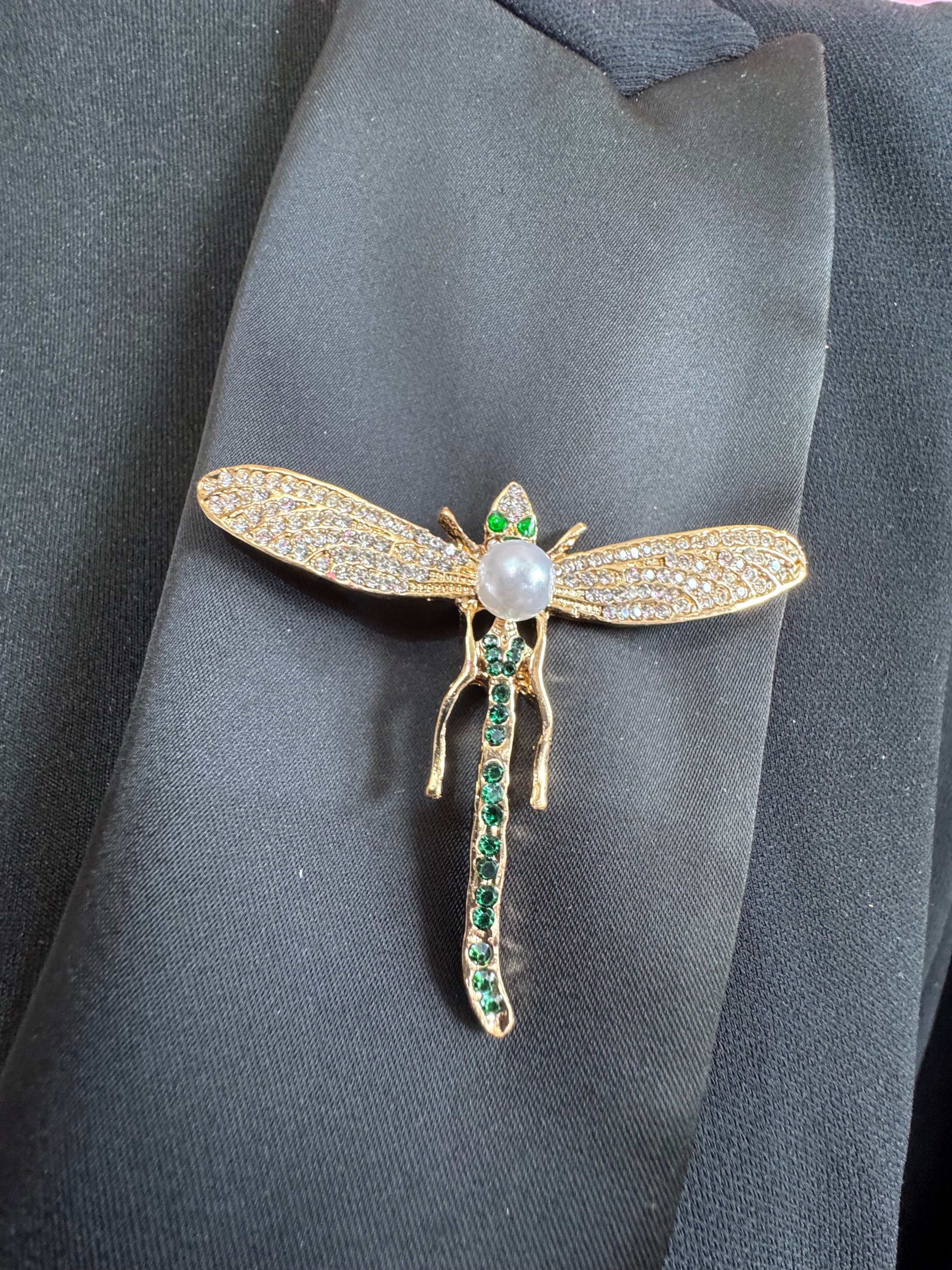 Gold dragonfly brooch set with a peal and green rhinestones