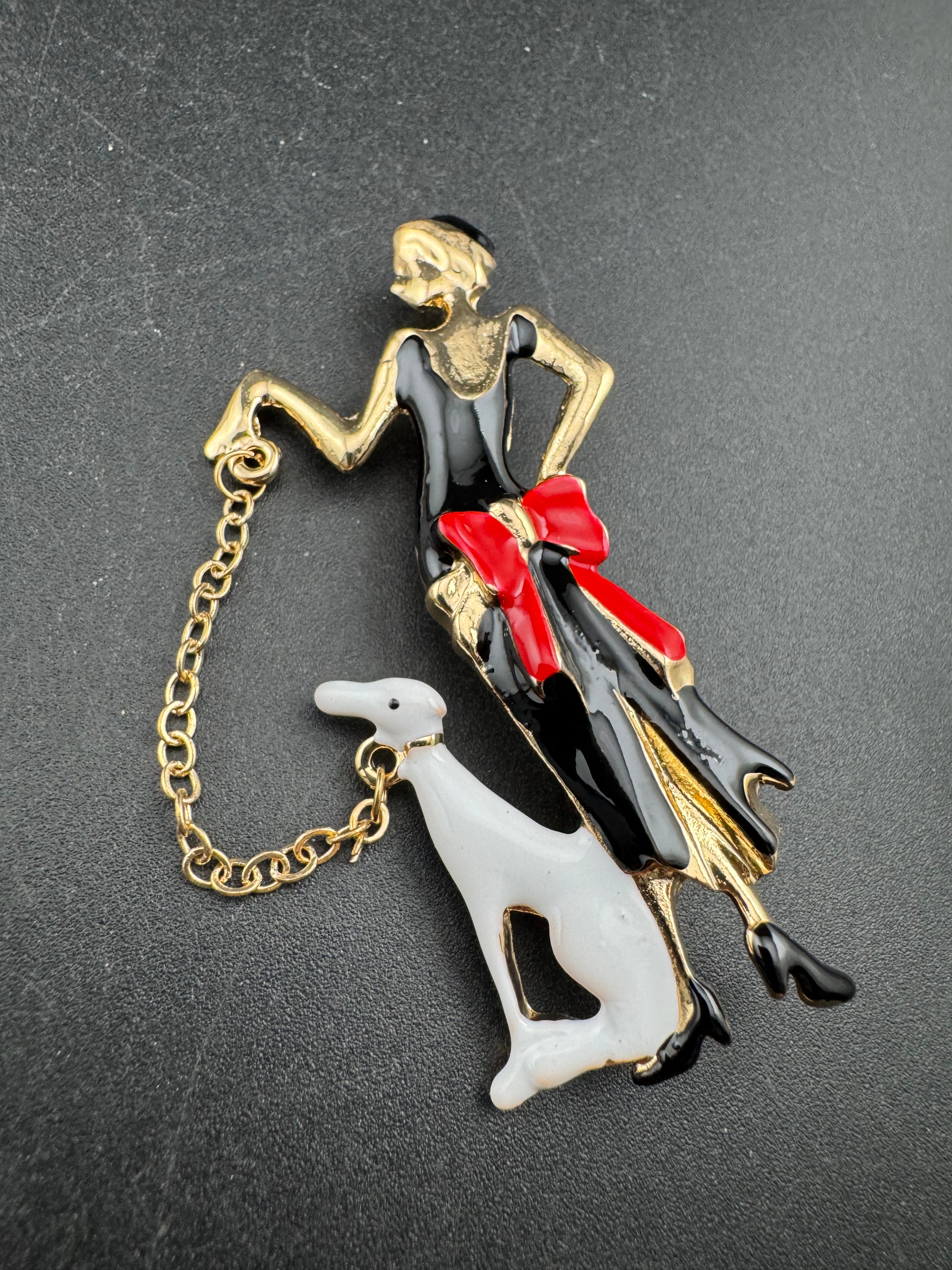 art deco lady with a dog on a lead brooch