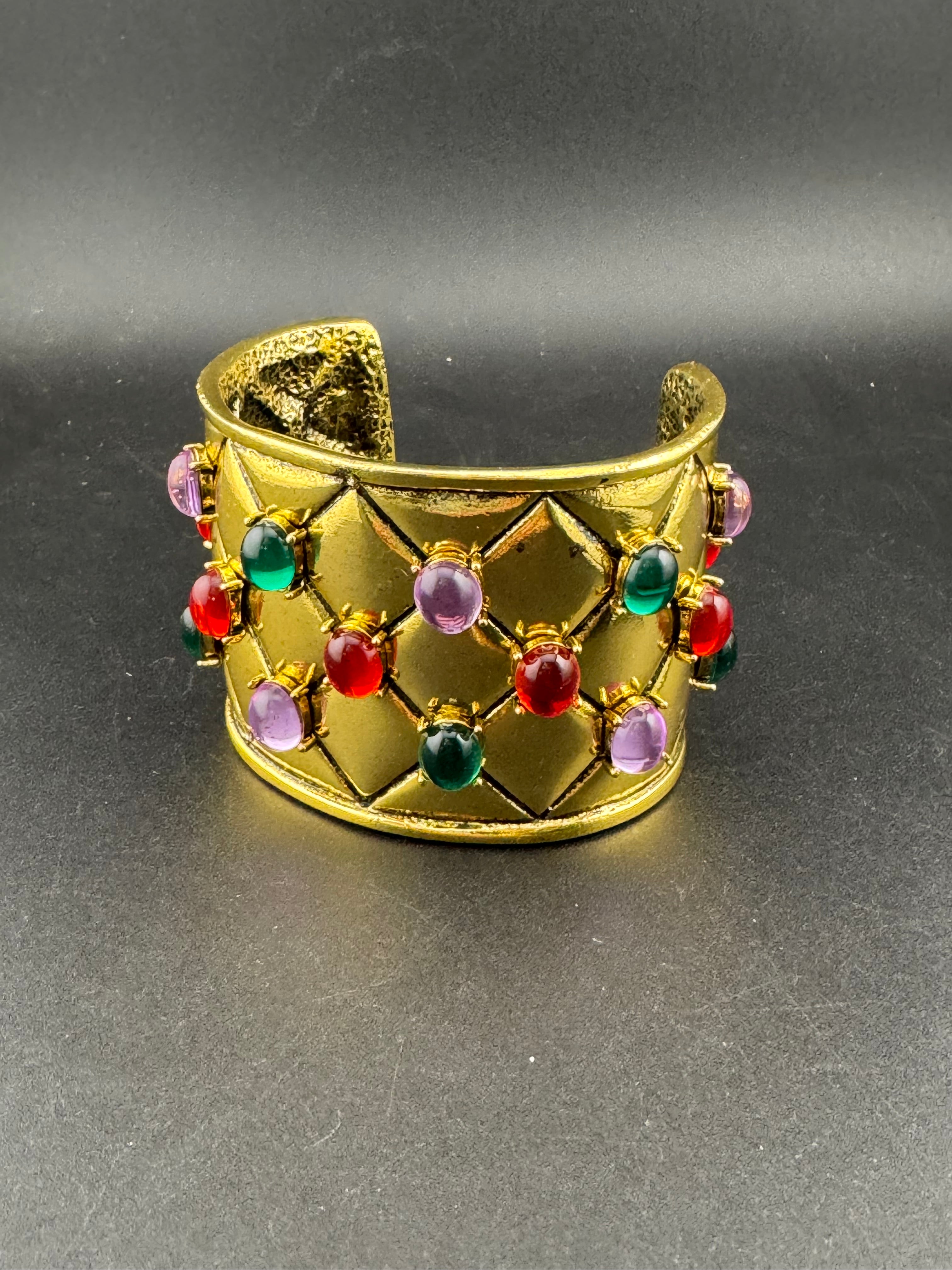 Etruscan style oversized open wide gold metal cushion cuff bangle with purple green red oval cabochons, medieval vibes