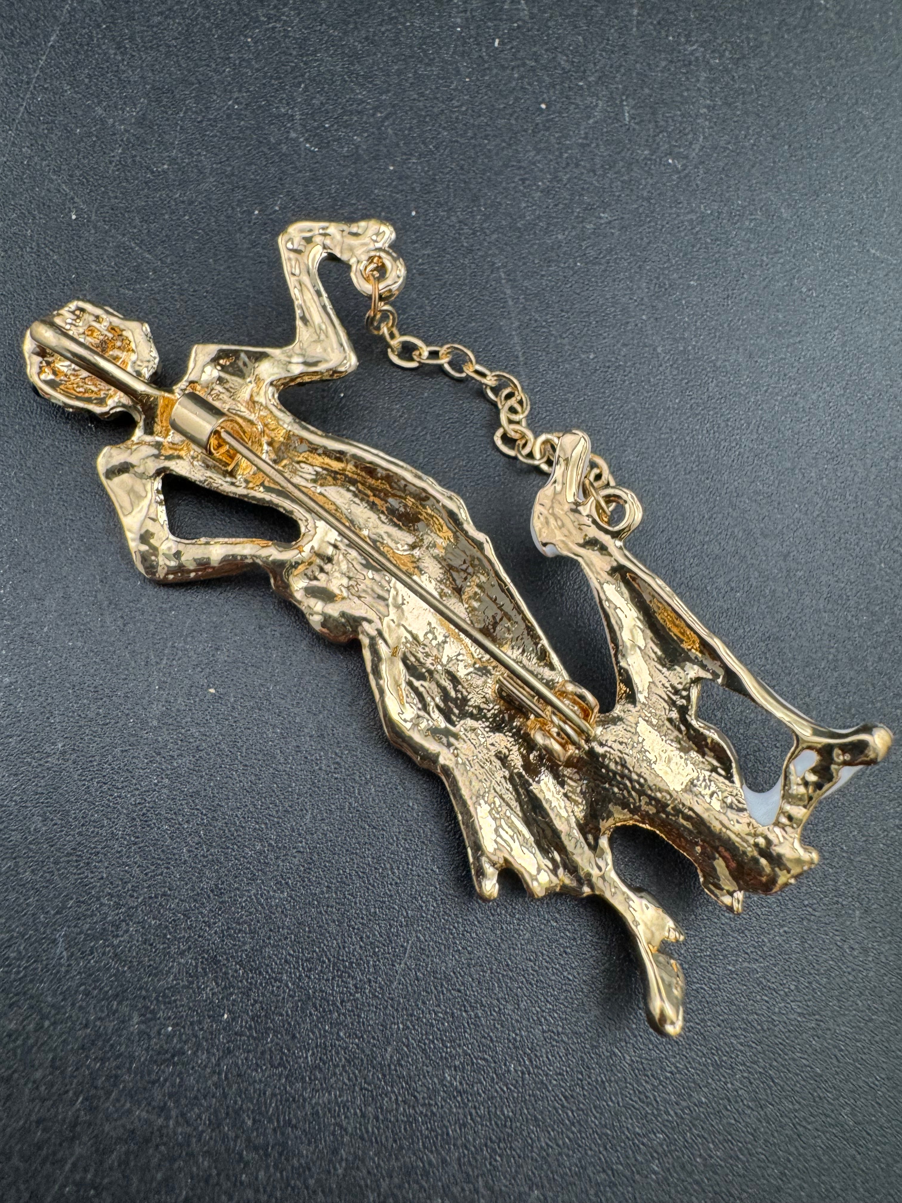 art deco lady with a dog on a lead brooch