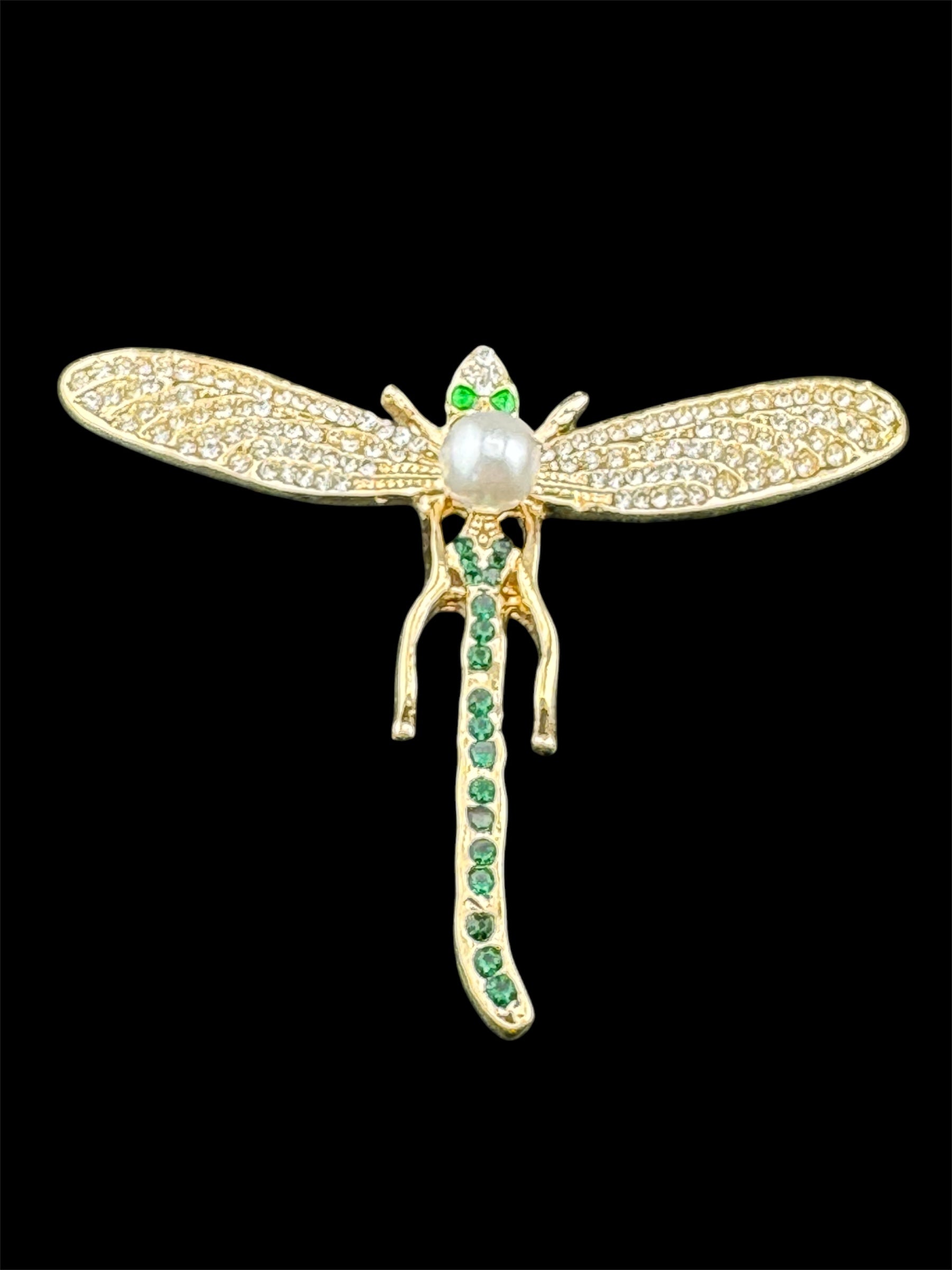 Gold dragonfly brooch set with a peal and green rhinestones