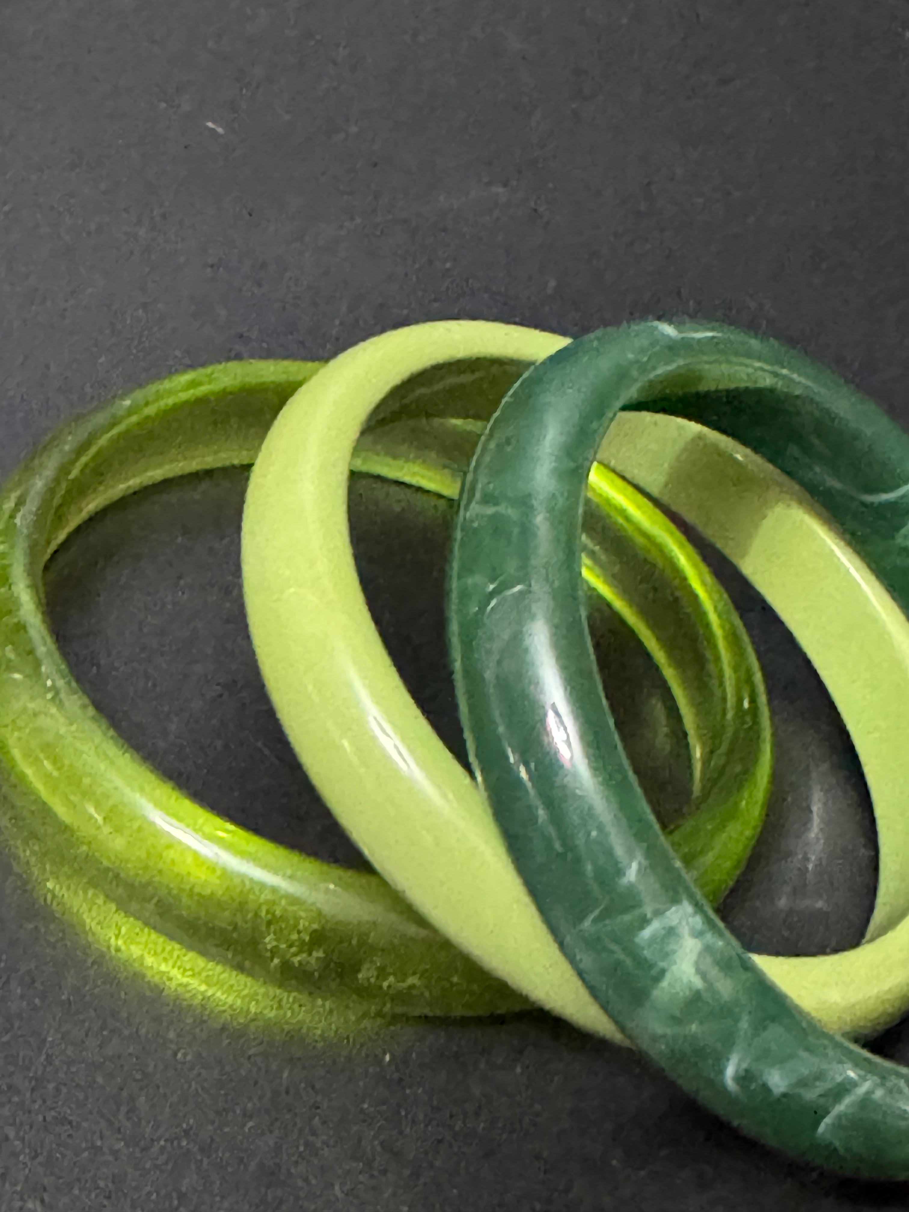 A trio of either orange or green tones mix and match acrylic bangles