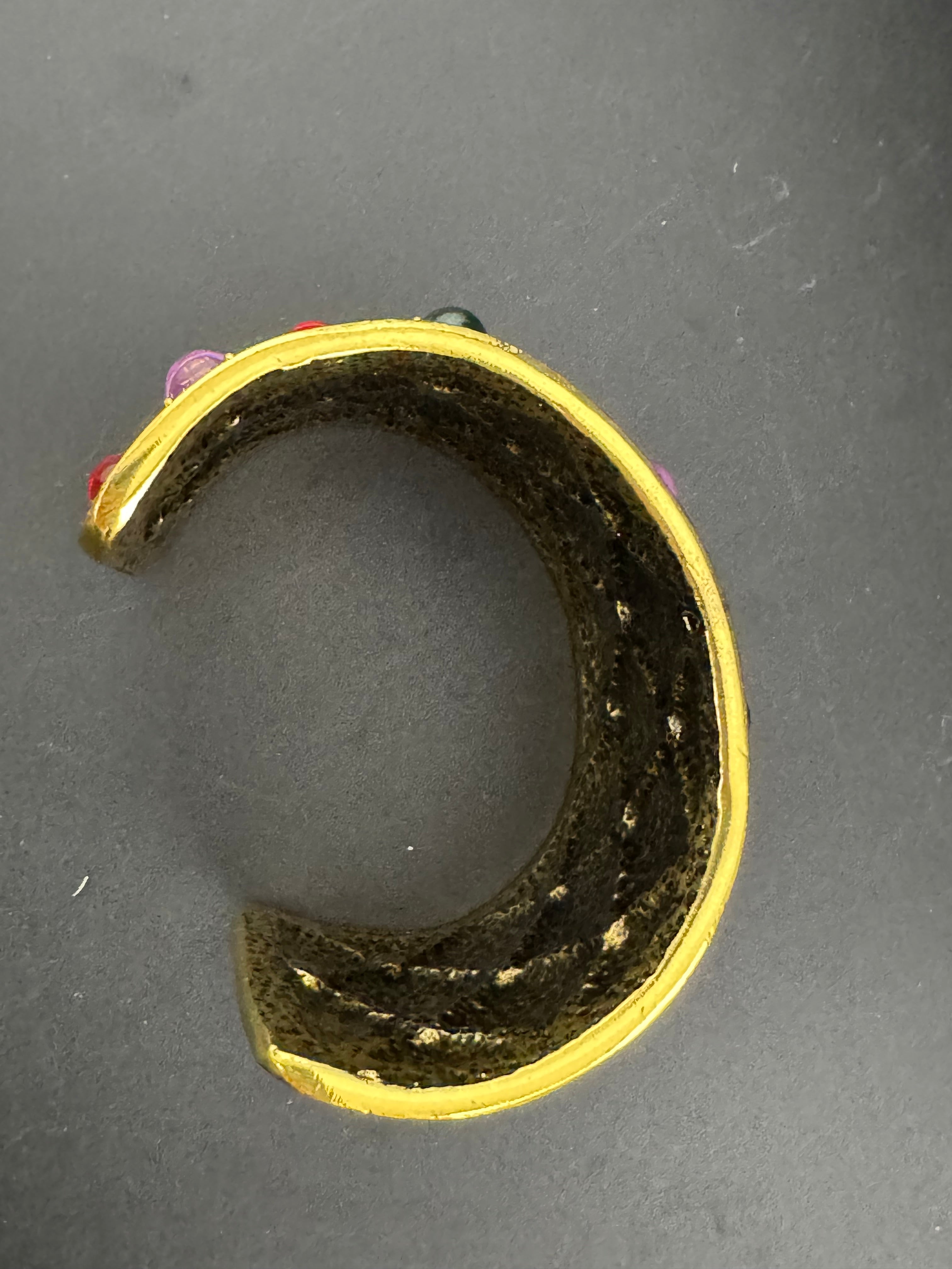 Etruscan style oversized open wide gold metal cushion cuff bangle with purple green red oval cabochons, medieval vibes