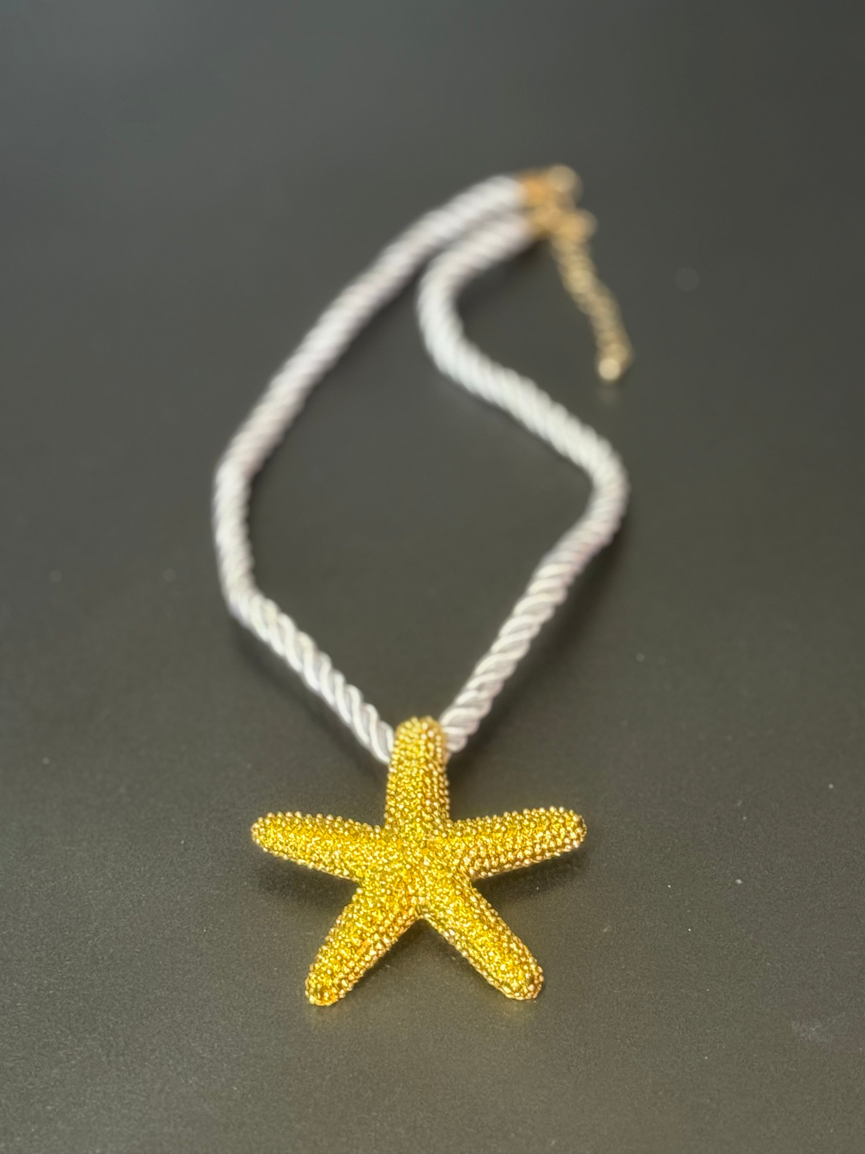 Big gold tone starfish nautical shell necklace on white cord
