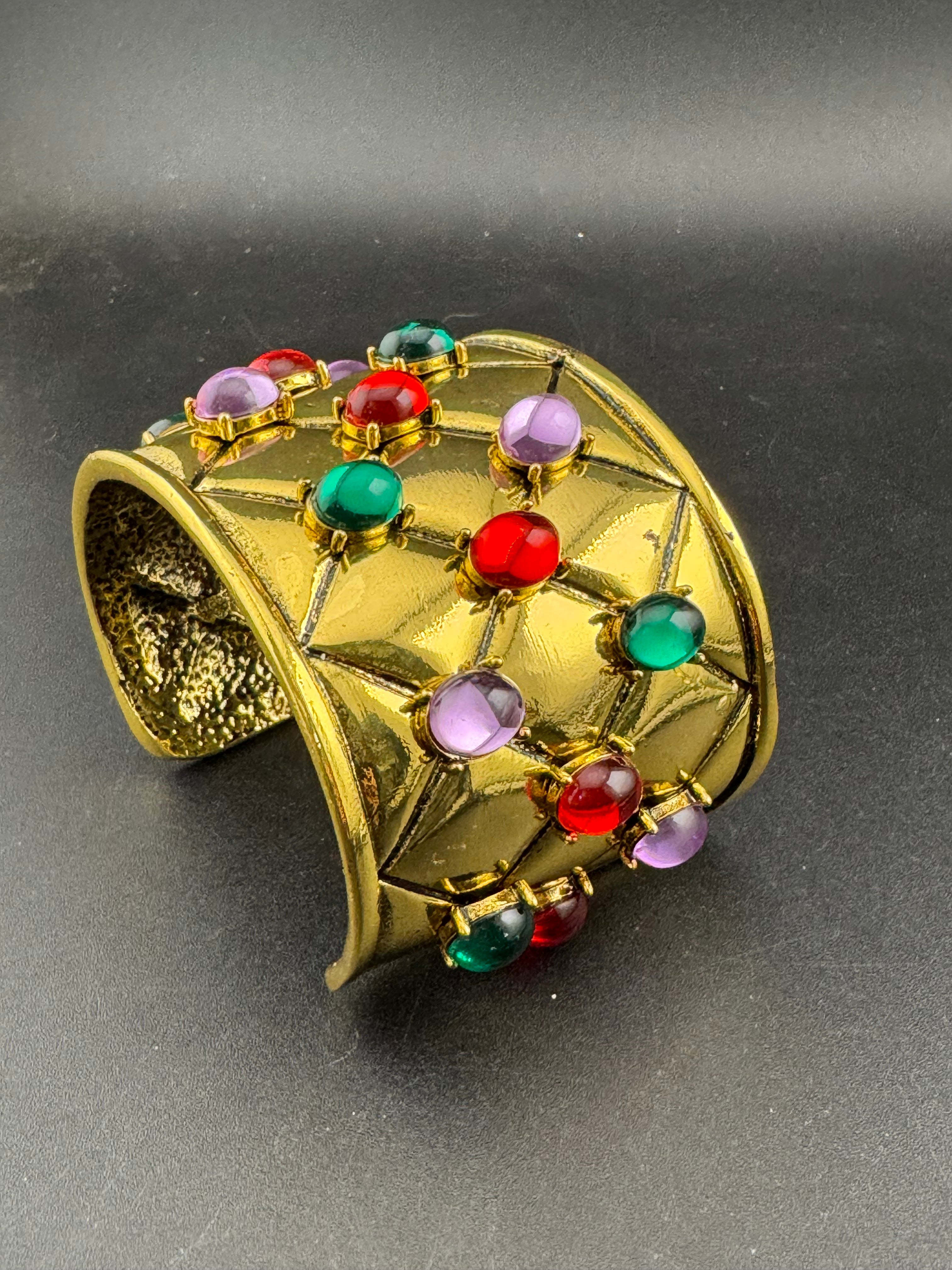 Etruscan style oversized open wide gold metal cushion cuff bangle with purple green red oval cabochons, medieval vibes