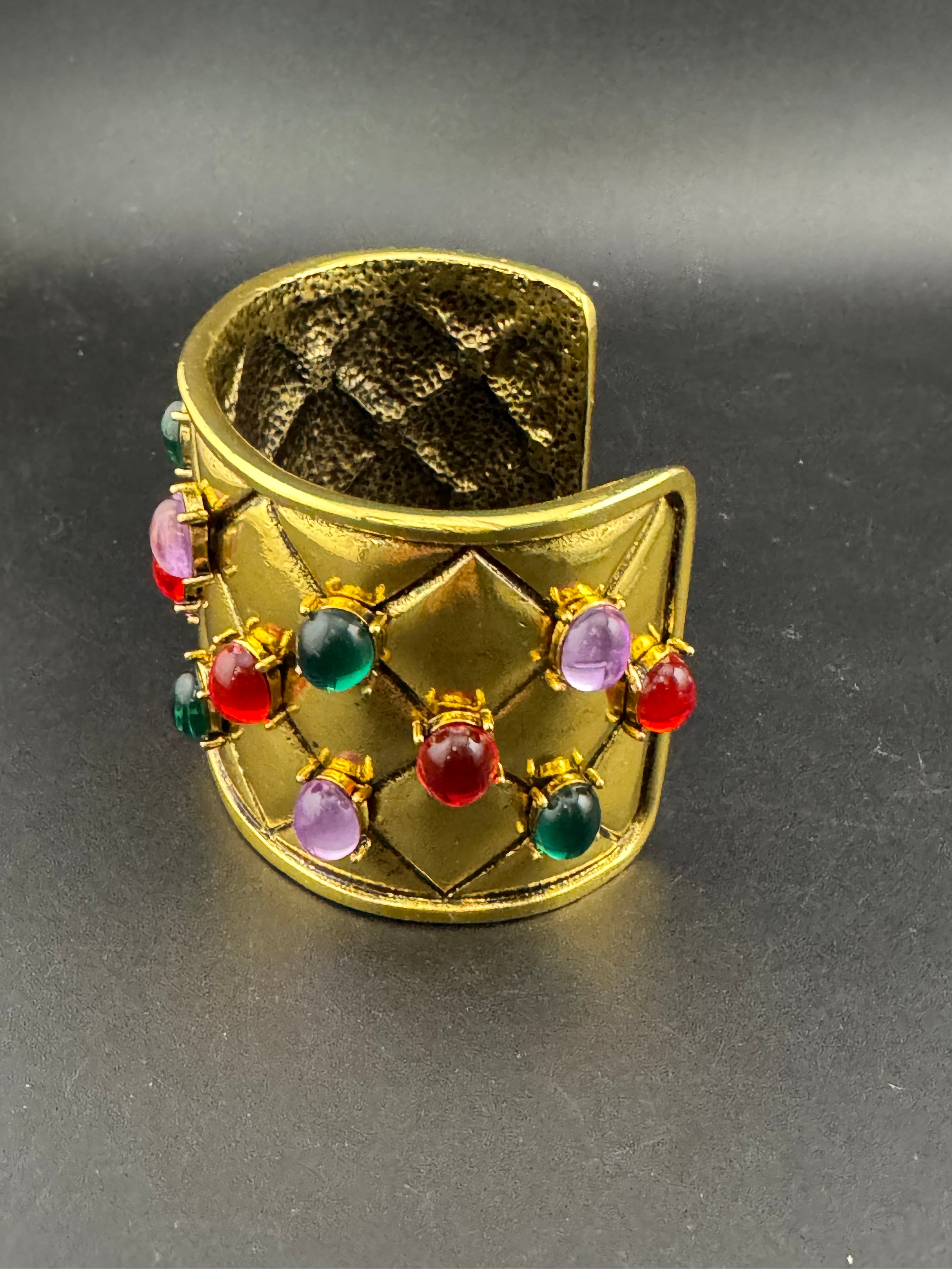 Etruscan style oversized open wide gold metal cushion cuff bangle with purple green red oval cabochons, medieval vibes