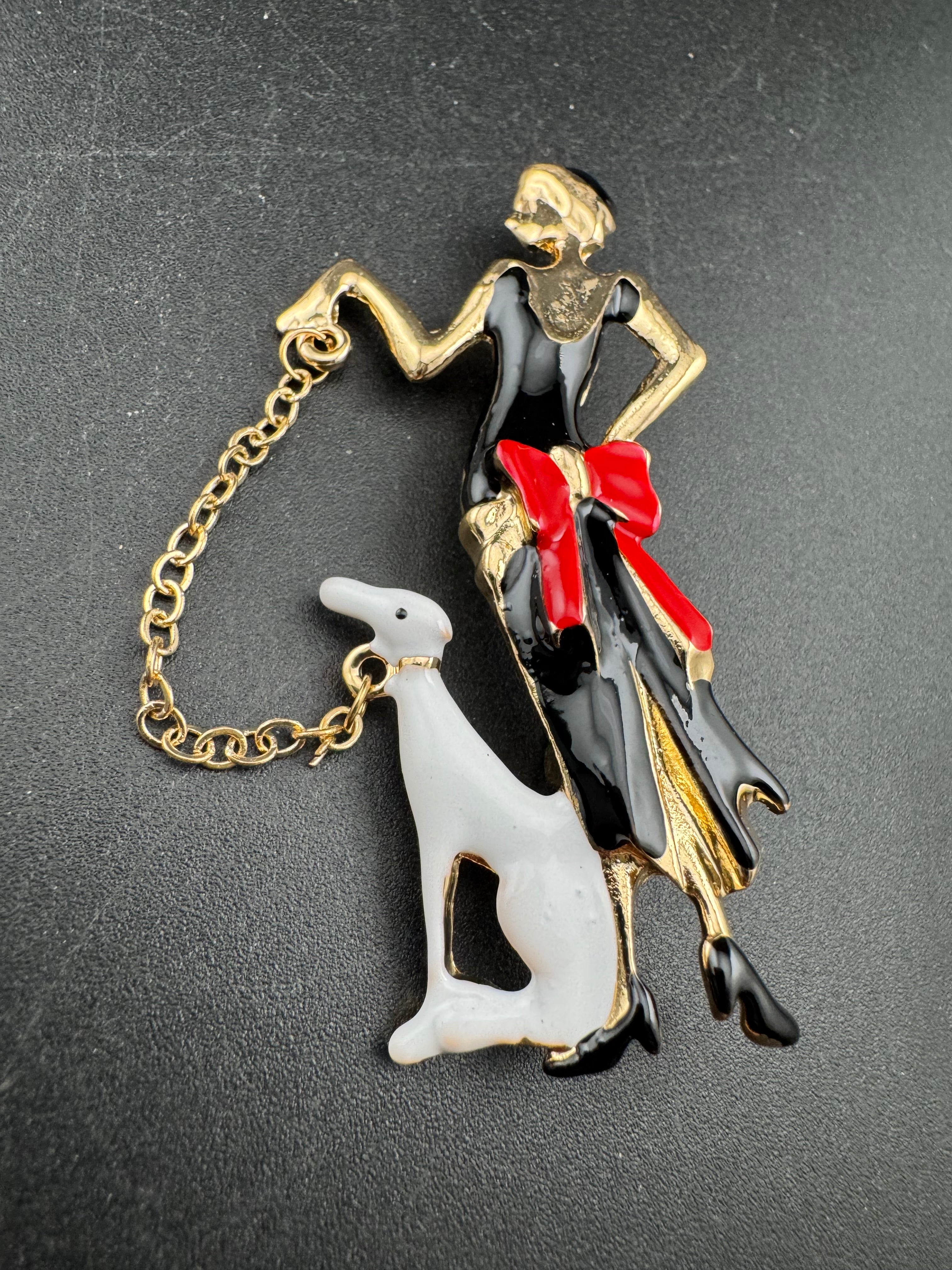 art deco lady with a dog on a lead brooch