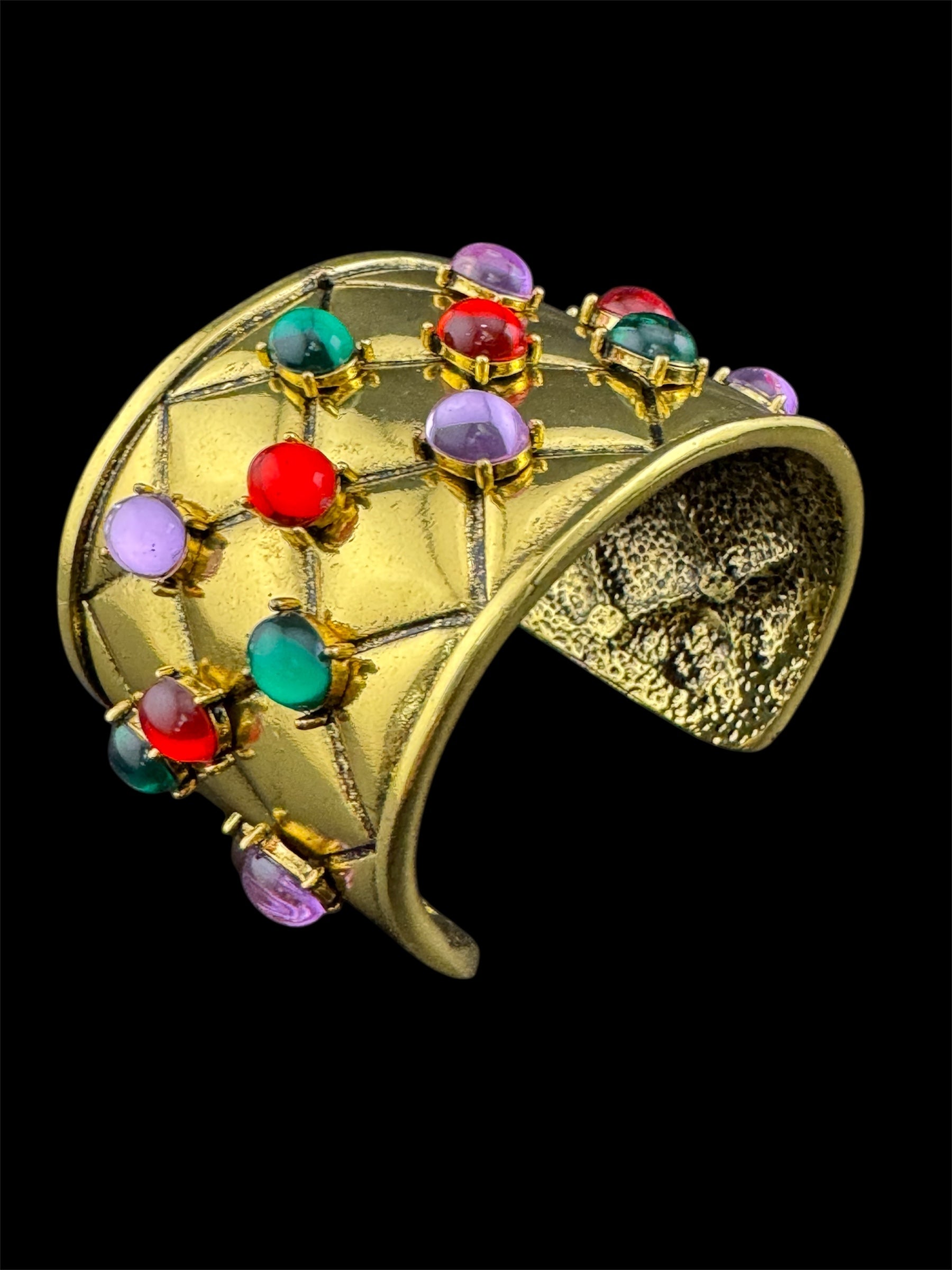 Etruscan style oversized open wide gold metal cushion cuff bangle with purple green red oval cabochons, medieval vibes