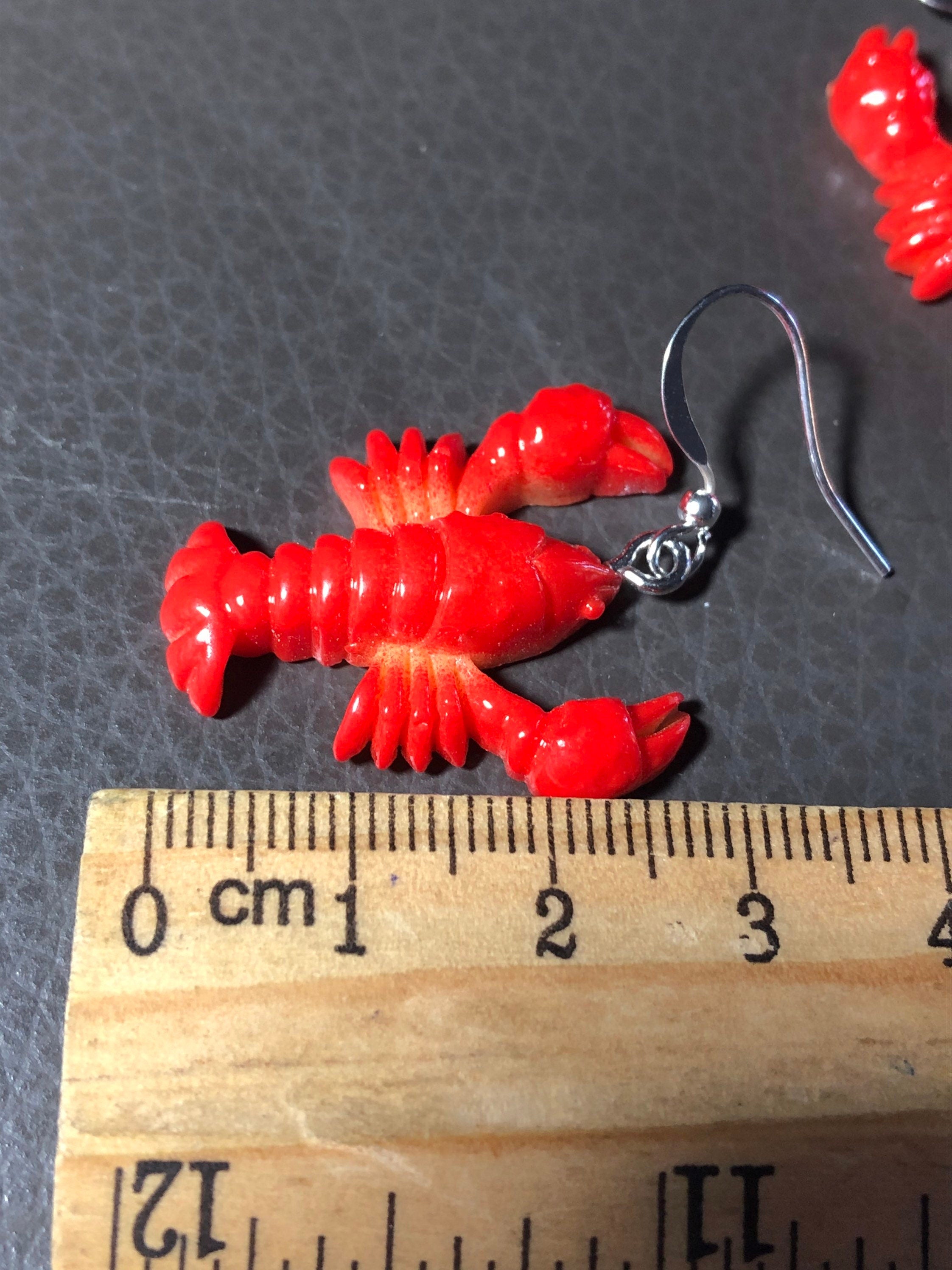 Orange plastic nautical lobster dangly earrings pierced ears