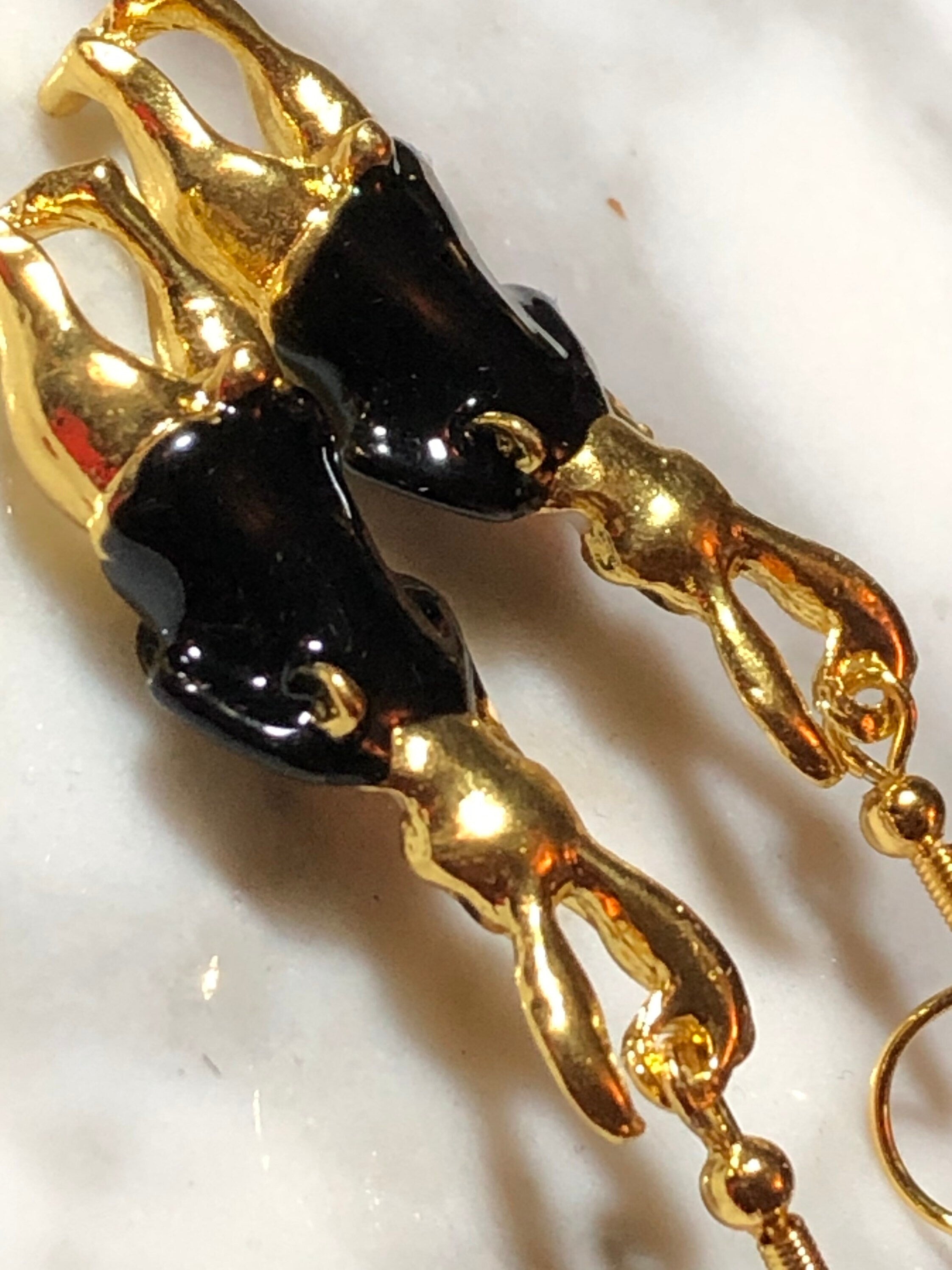 Alice in wonderland inspired rabbit earrings for pierced ears gold tone black white enamel