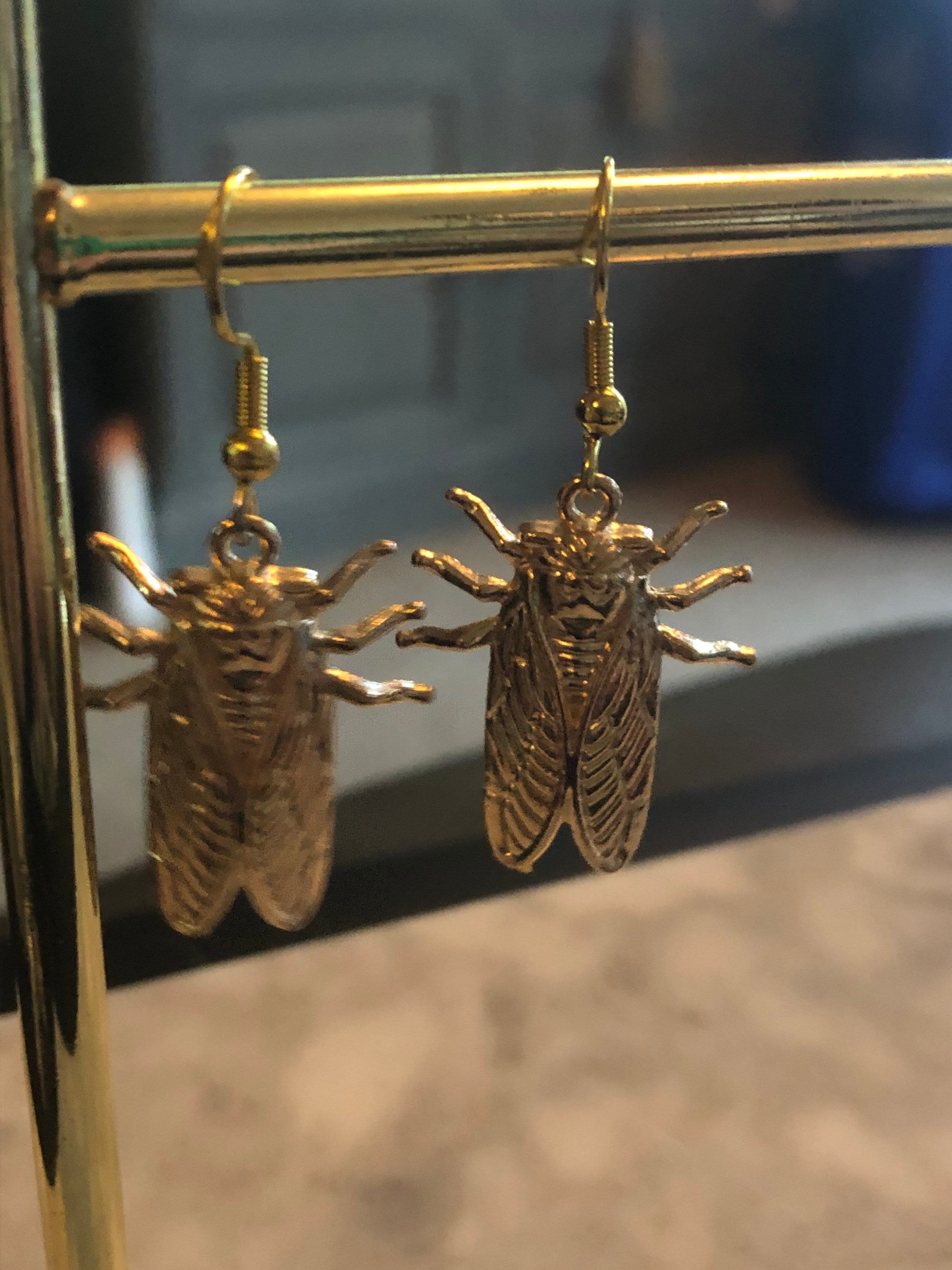 gold tone Cicada bug earrings for pierced ears
