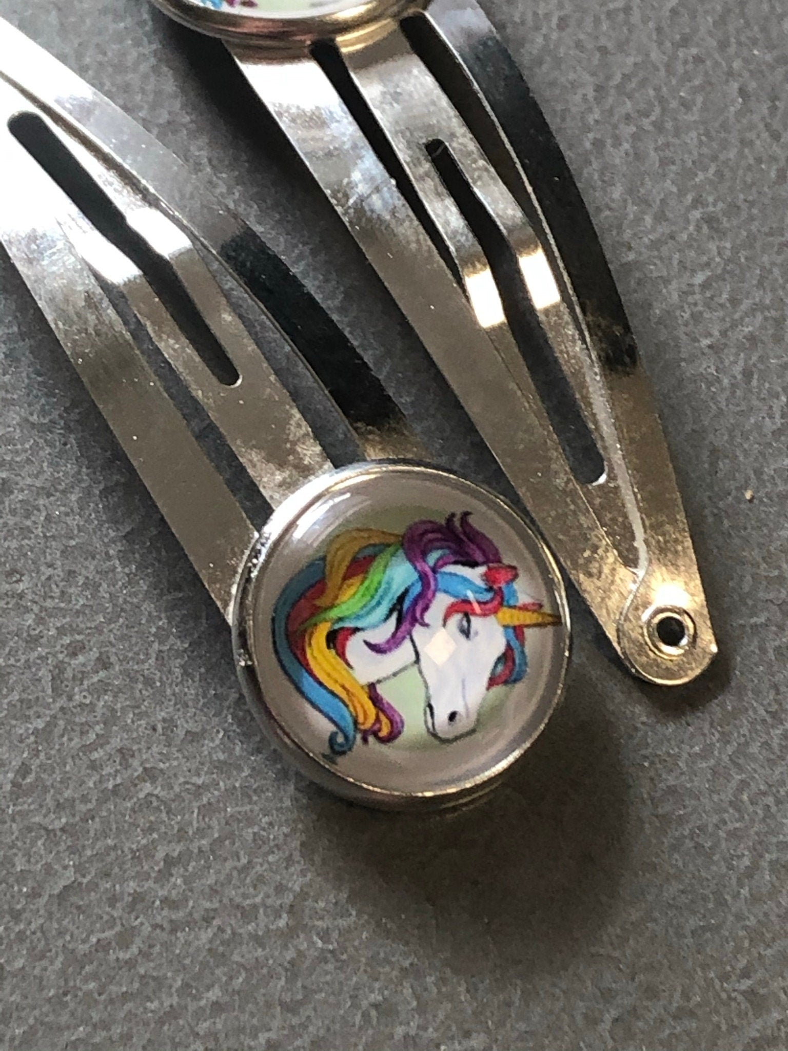 pair of Unicorn hair clips silver tone snap lock closure