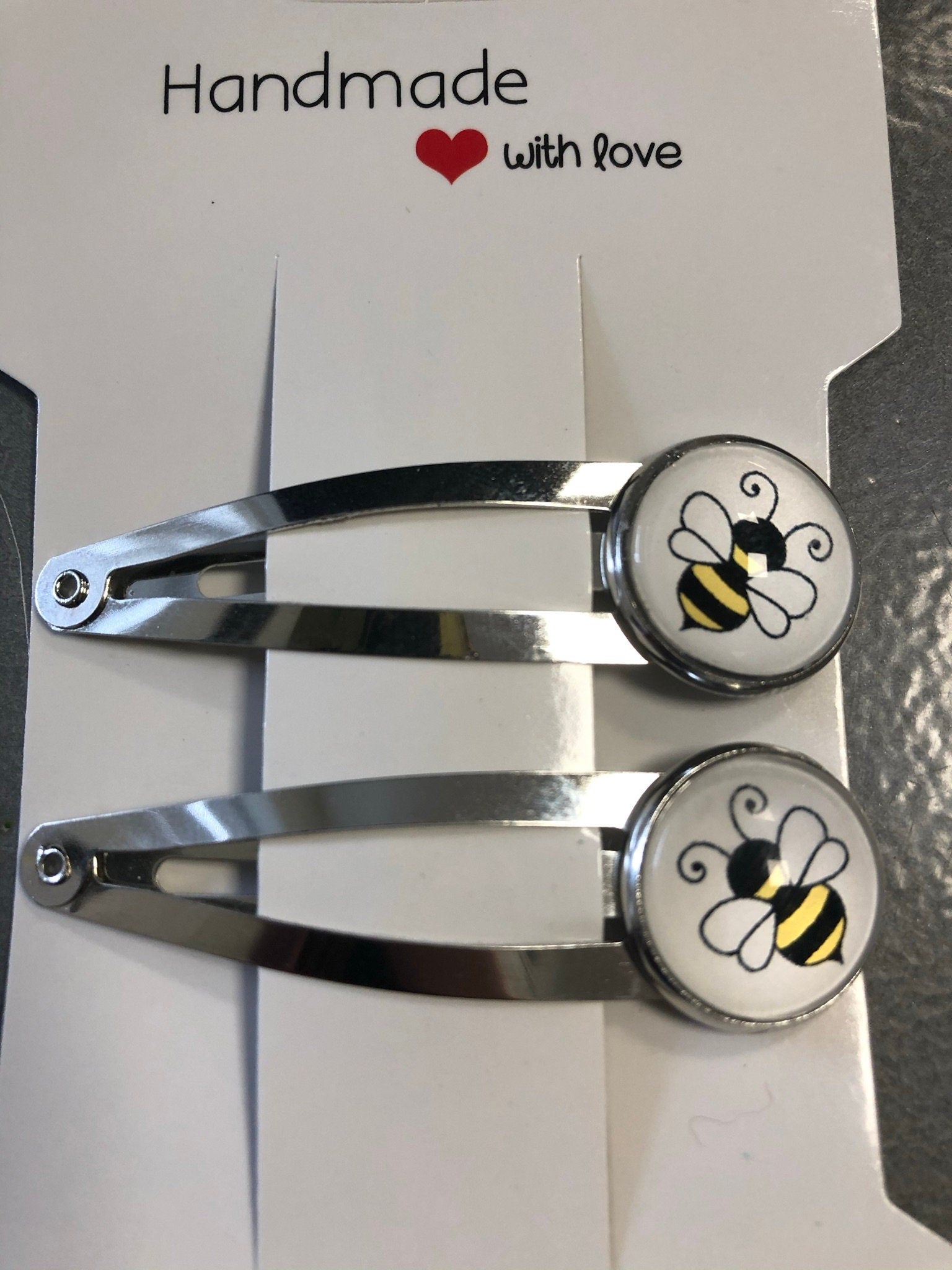 pair of bee hair clips silver tone snap lock closure