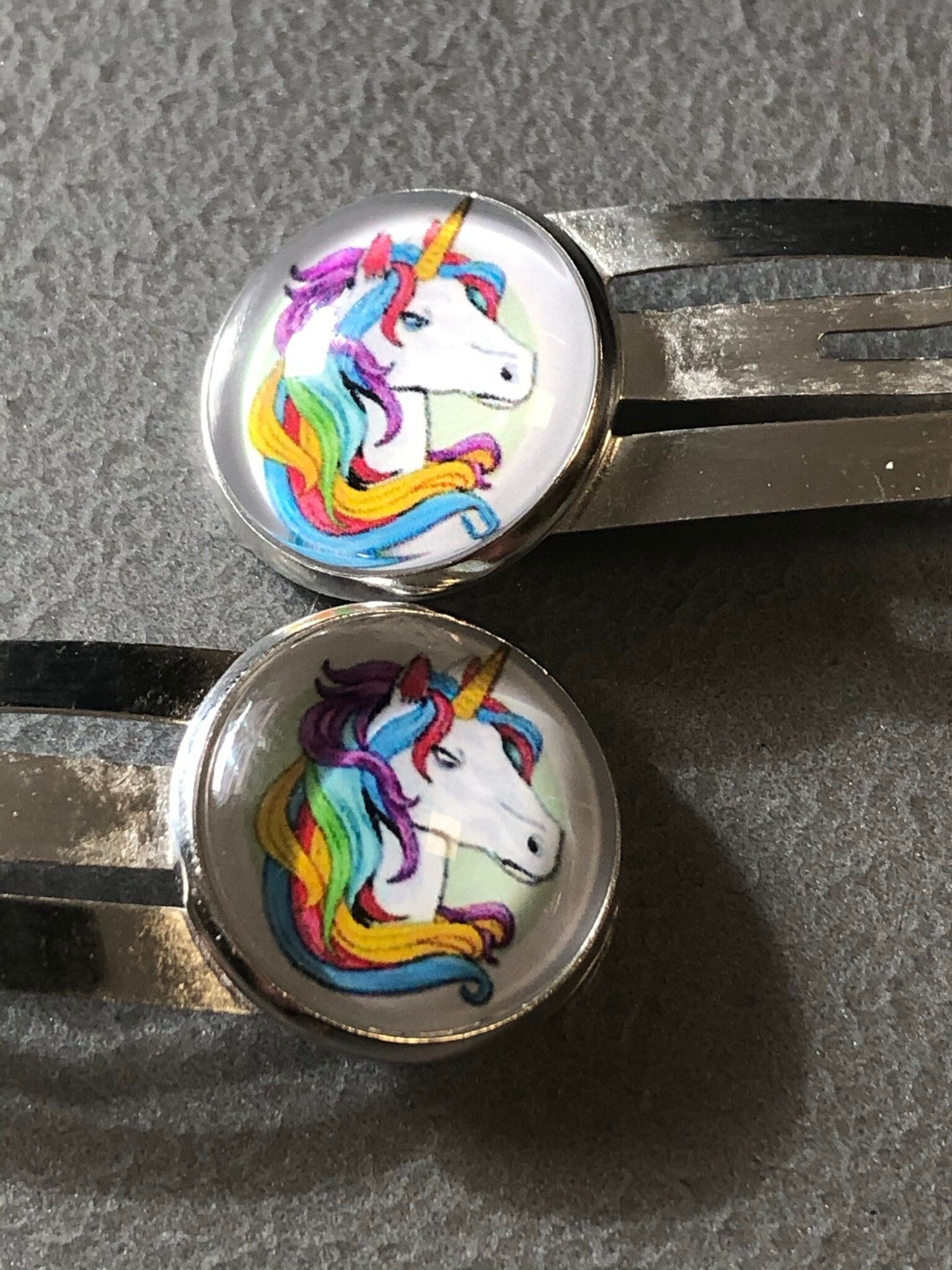 pair of Unicorn hair clips silver tone snap lock closure