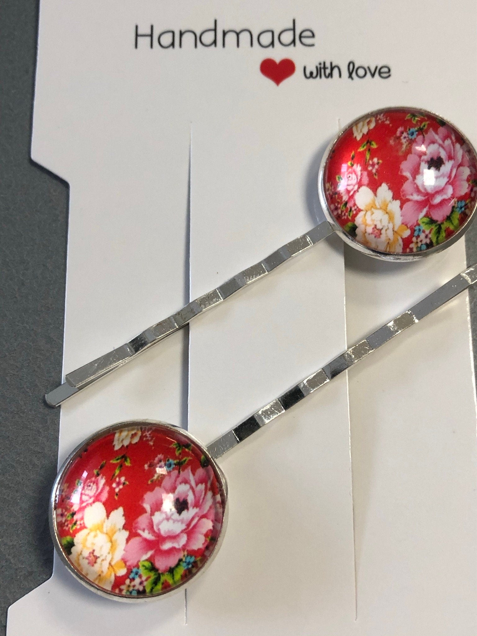 pair of red ditsy floral roses hair clips silver tone