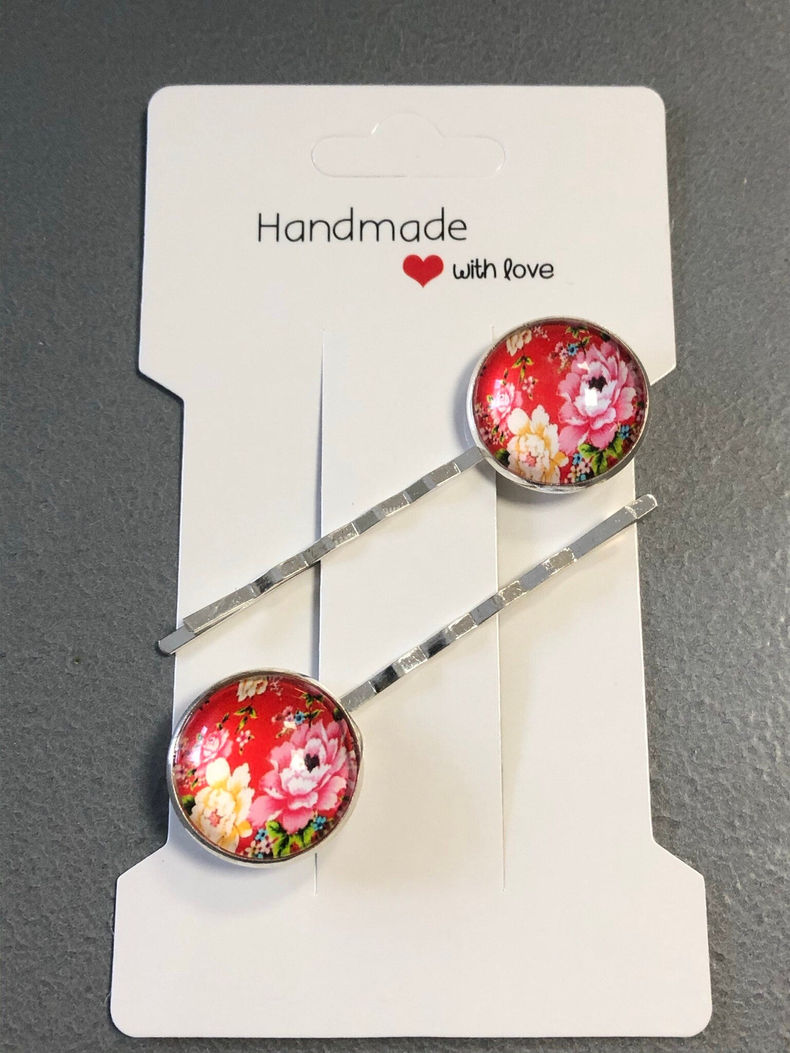 pair of red ditsy floral roses hair clips silver tone