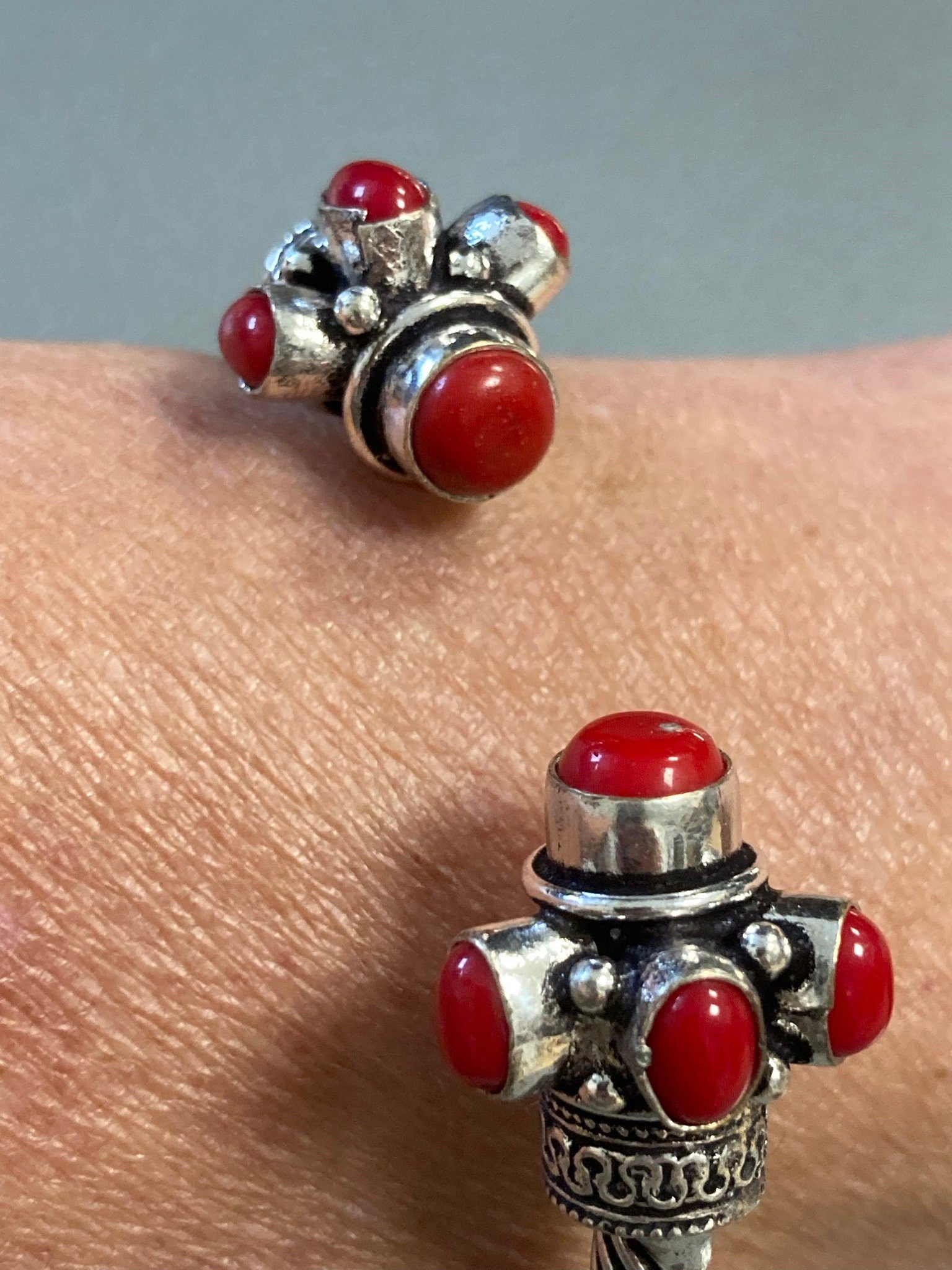 Silver tone torque cuff bangle bracelet with red coral cabochons