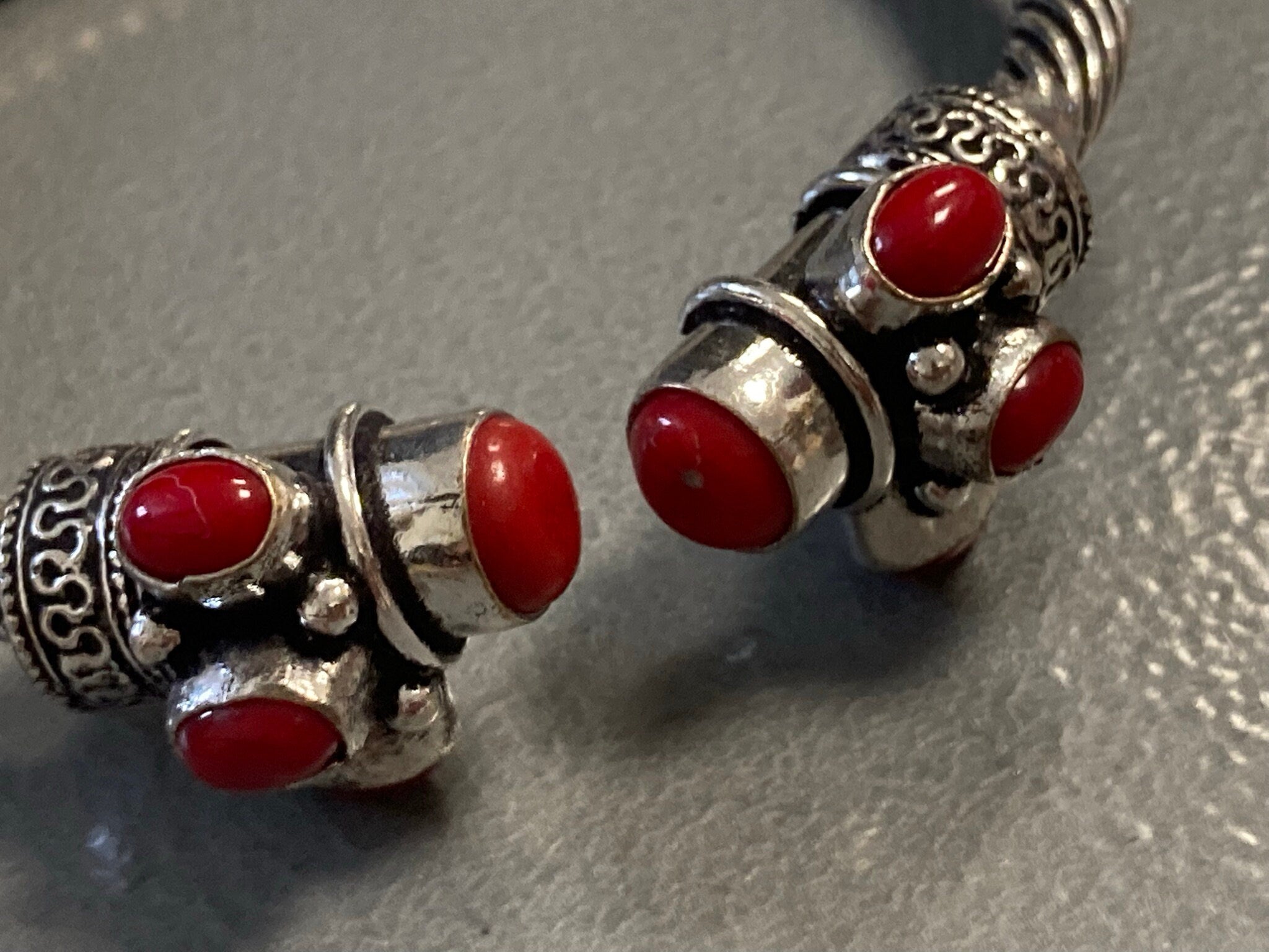 Silver tone torque cuff bangle bracelet with red coral cabochons