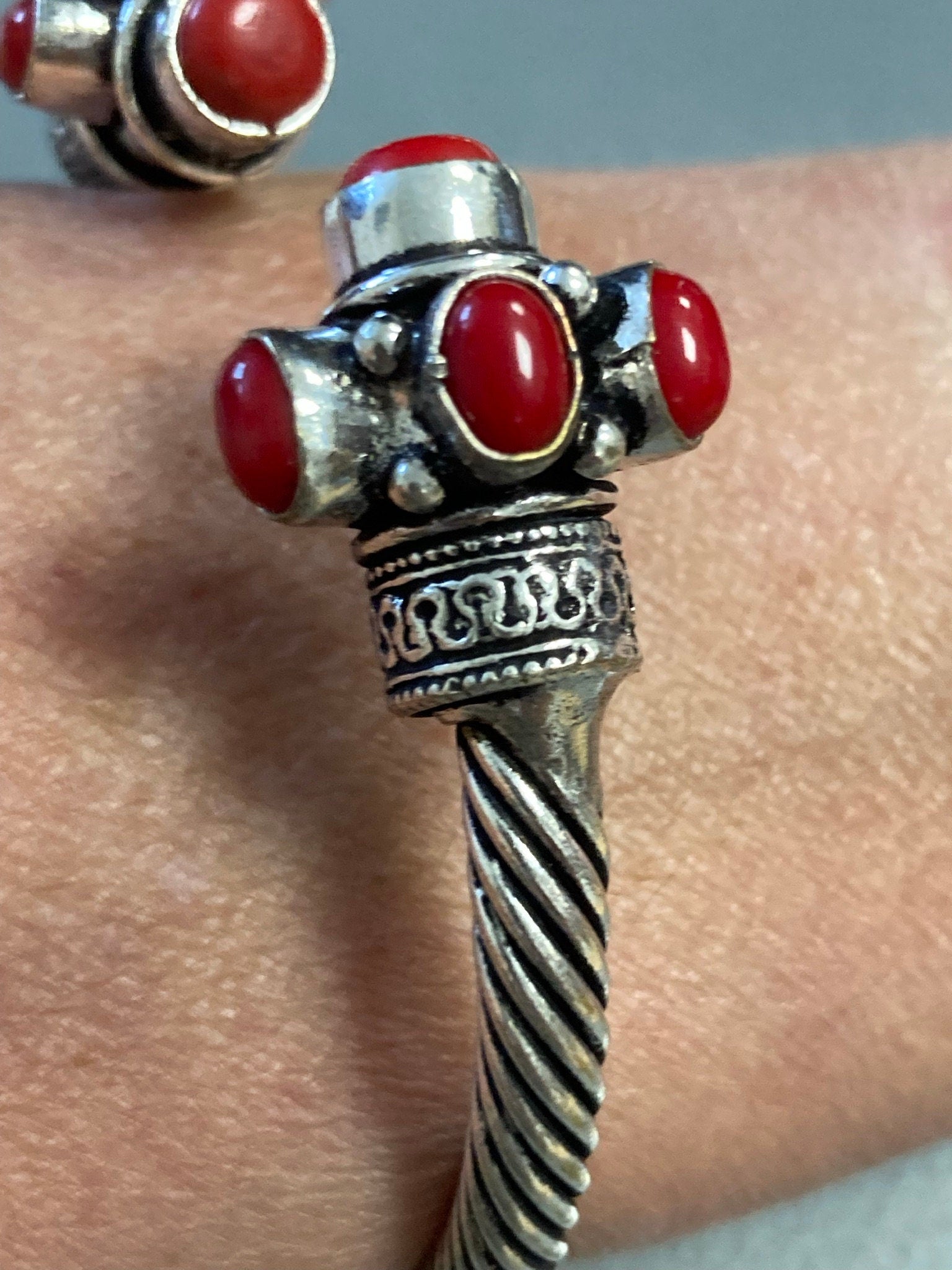 Silver tone torque cuff bangle bracelet with red coral cabochons