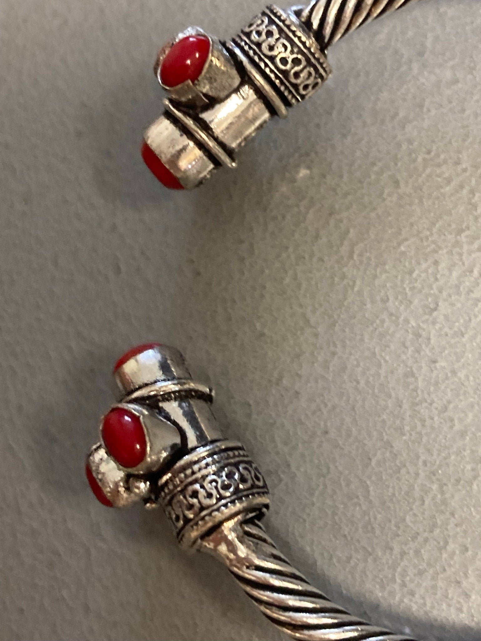 Silver tone torque cuff bangle bracelet with red coral cabochons