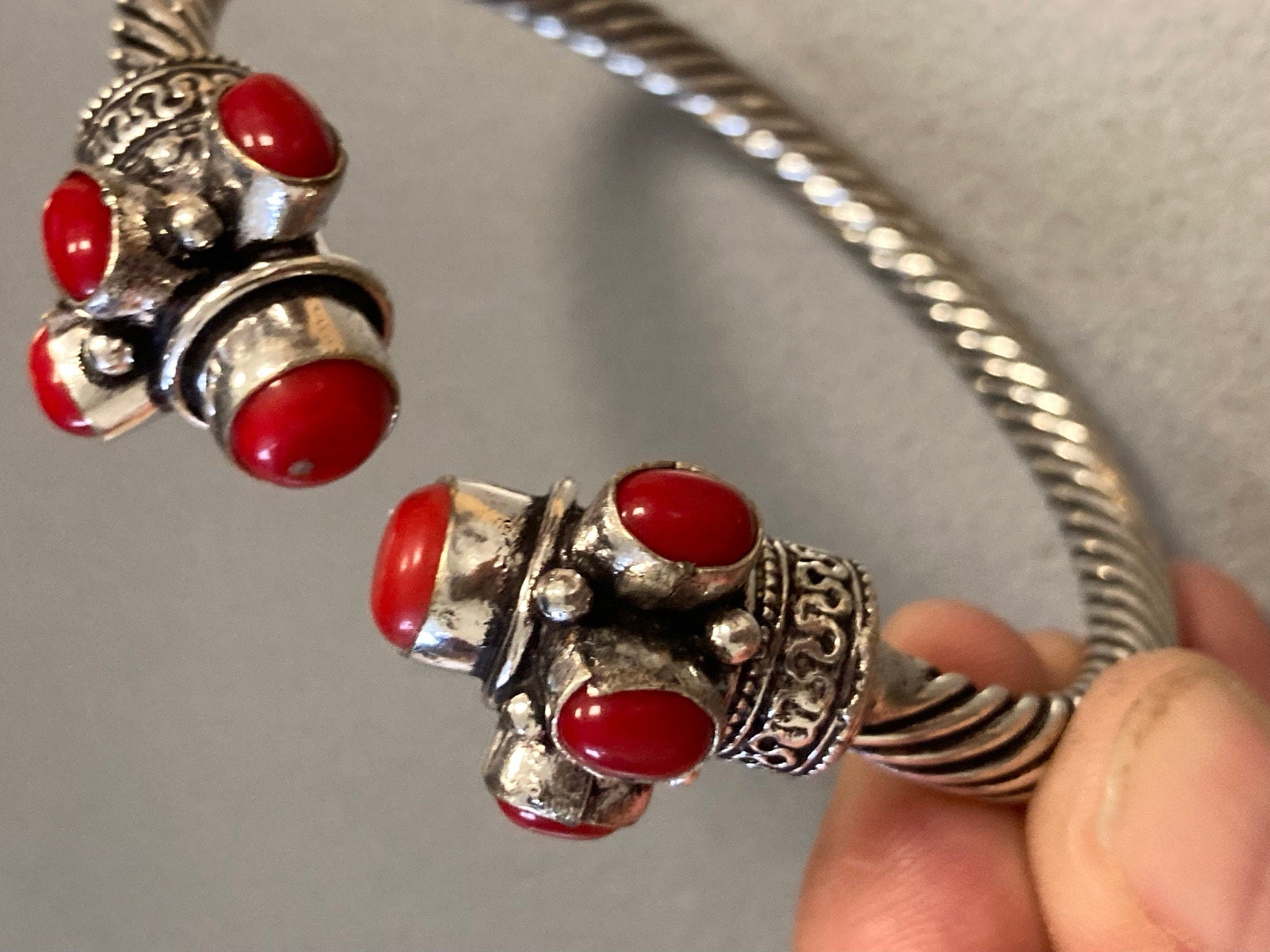 Silver tone torque cuff bangle bracelet with red coral cabochons