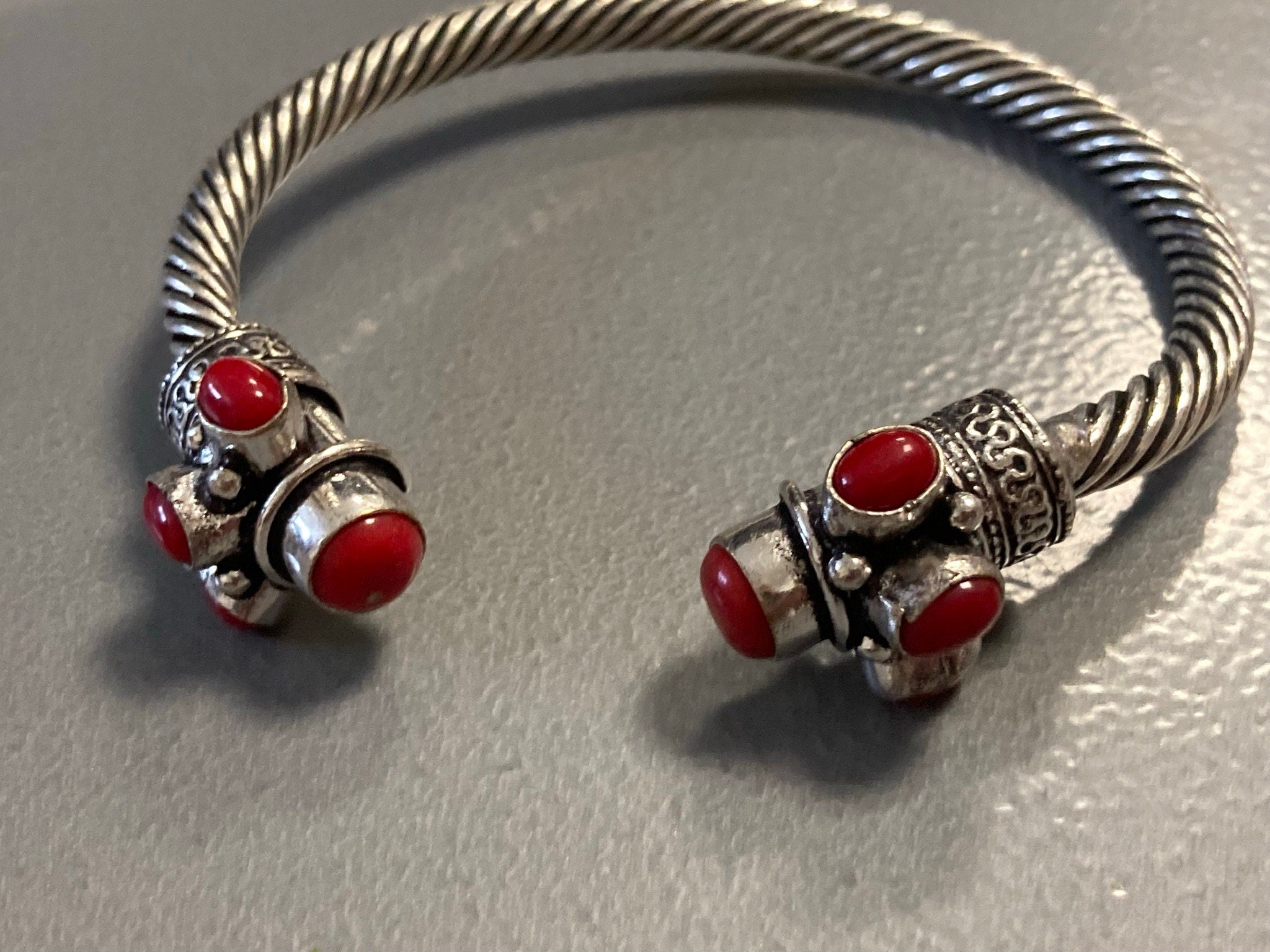 Silver tone torque cuff bangle bracelet with red coral cabochons