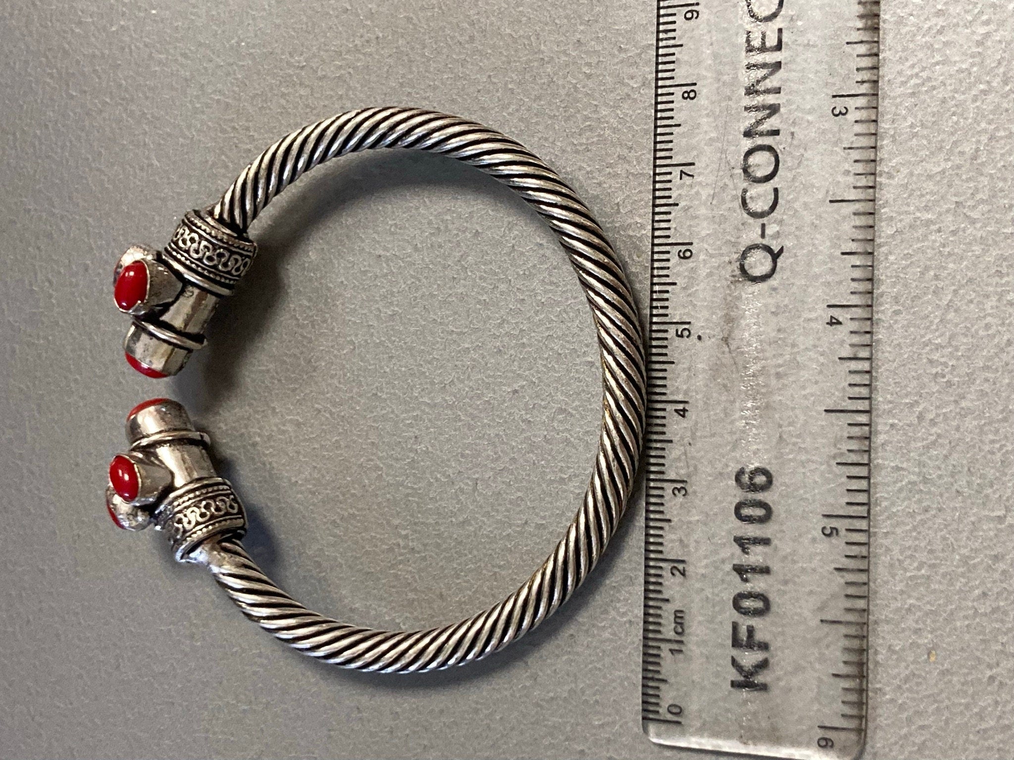 Silver tone torque cuff bangle bracelet with red coral cabochons