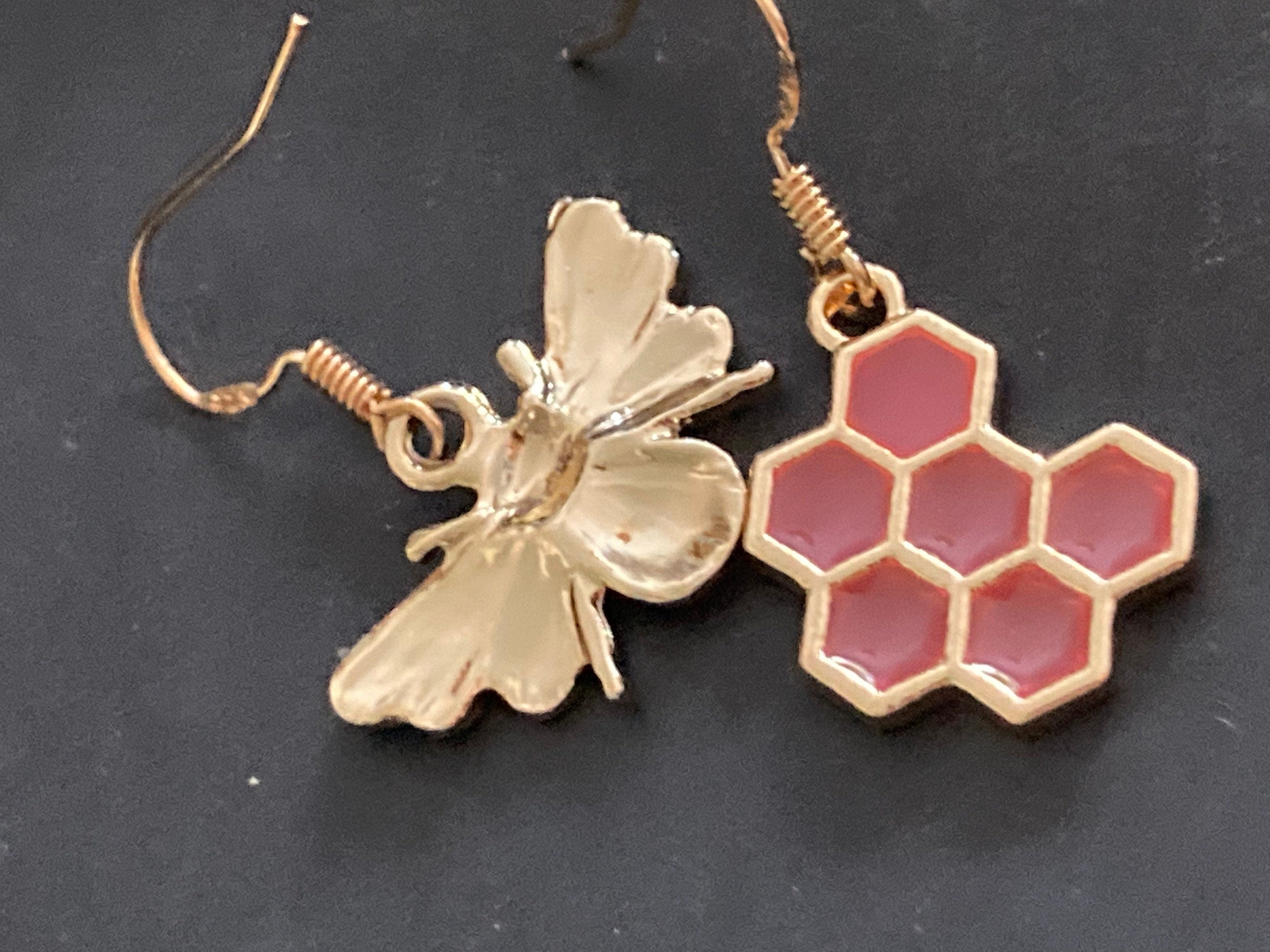 Gold tone pink bumble bee and pink honeycomb drop earrings