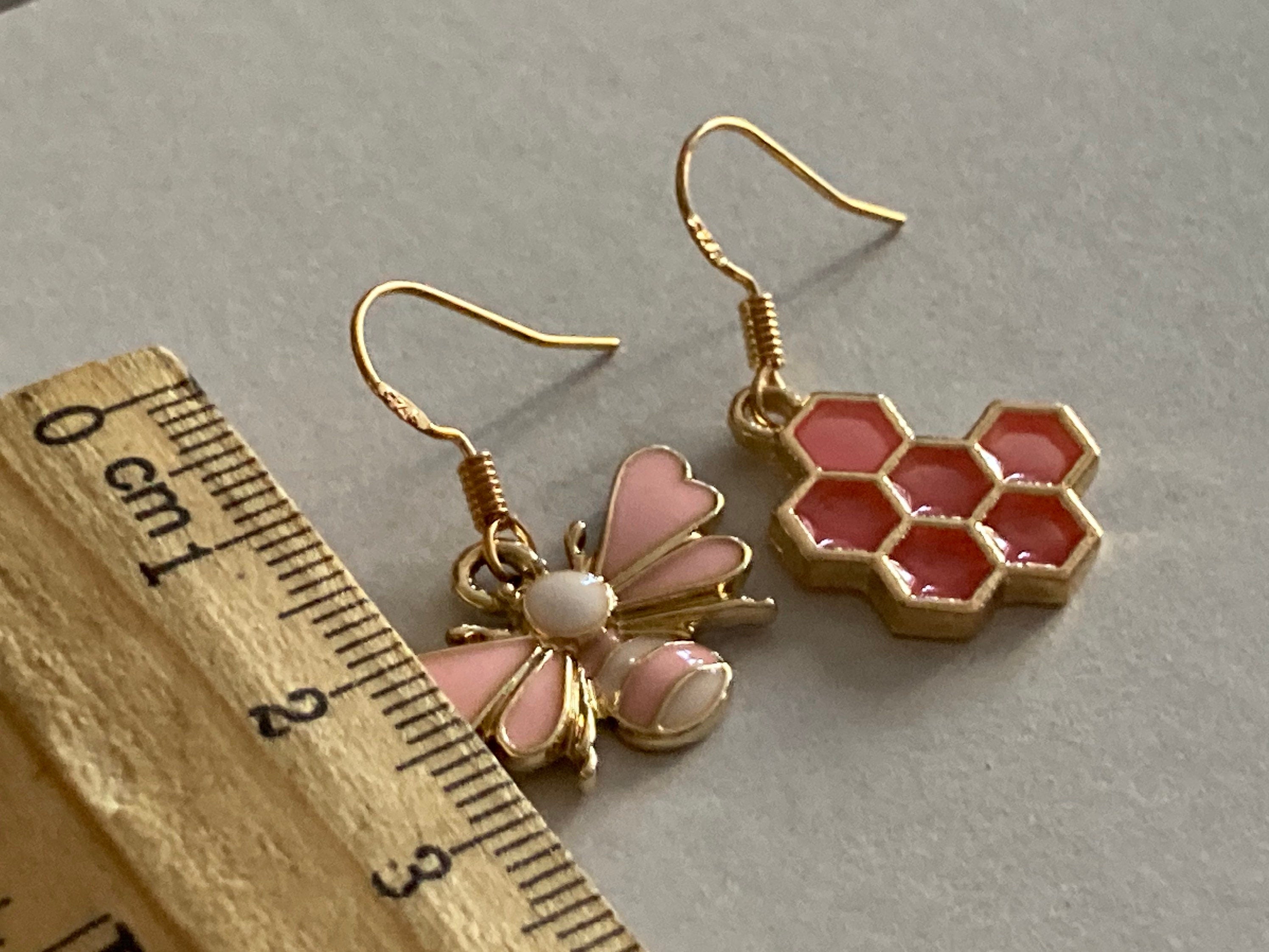Gold tone pink bumble bee and pink honeycomb drop earrings