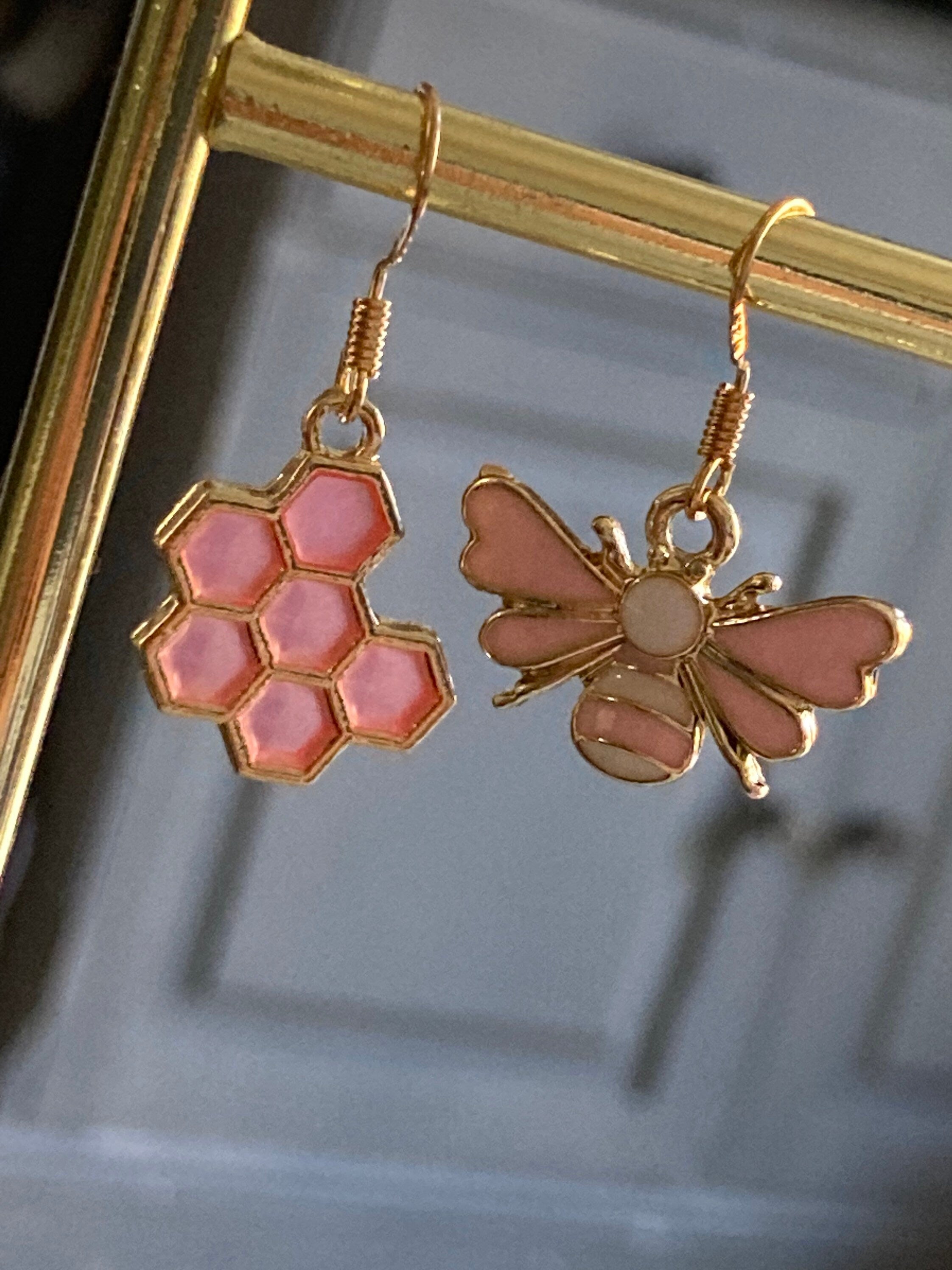 Gold tone pink bumble bee and pink honeycomb drop earrings