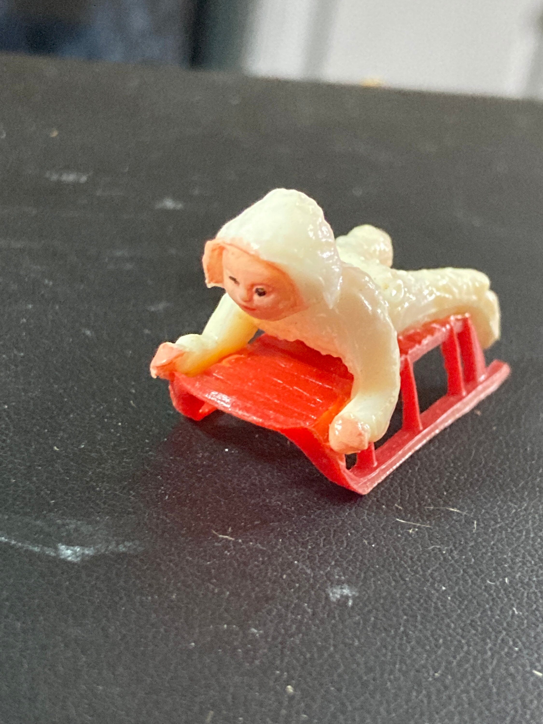 Vintage 1960s 1 x miniature snow boy on sledge snow baby Christmas cake topper