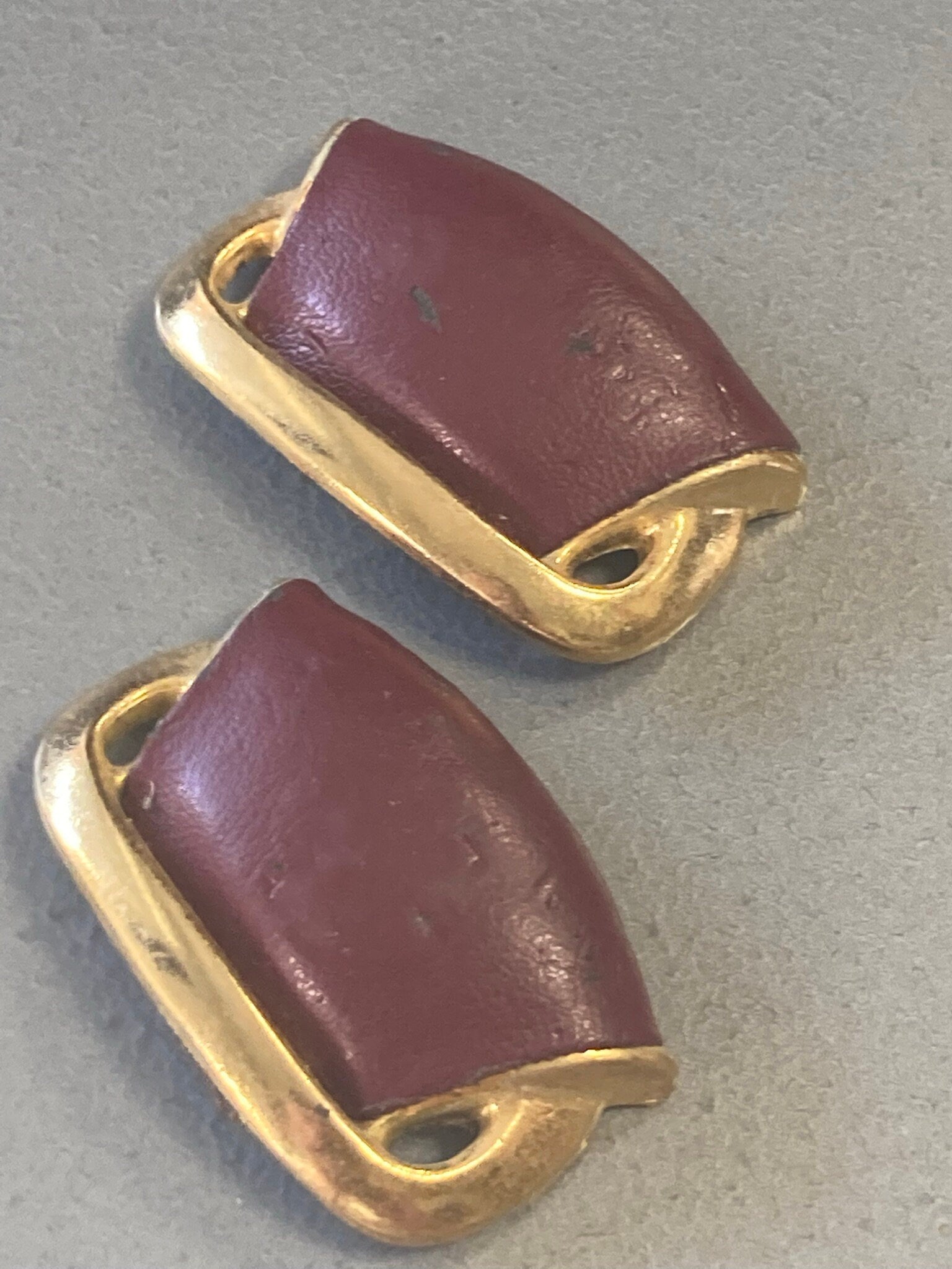 pair of Maroon Burgundy Oxblood red leather and gold tone shoe clips