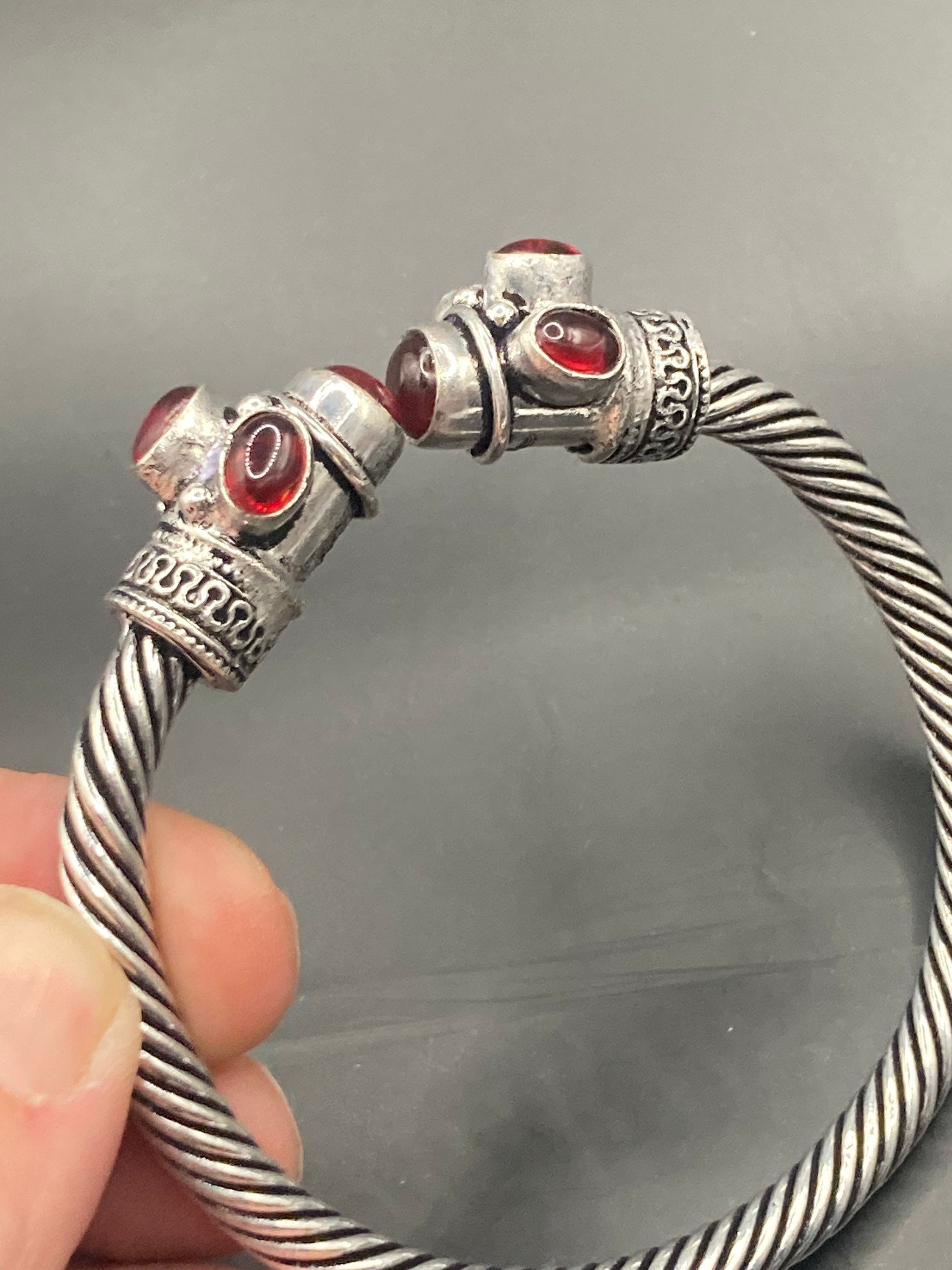 silver tone metal torque cuff bangle bracelet ruby red garnet glass stones