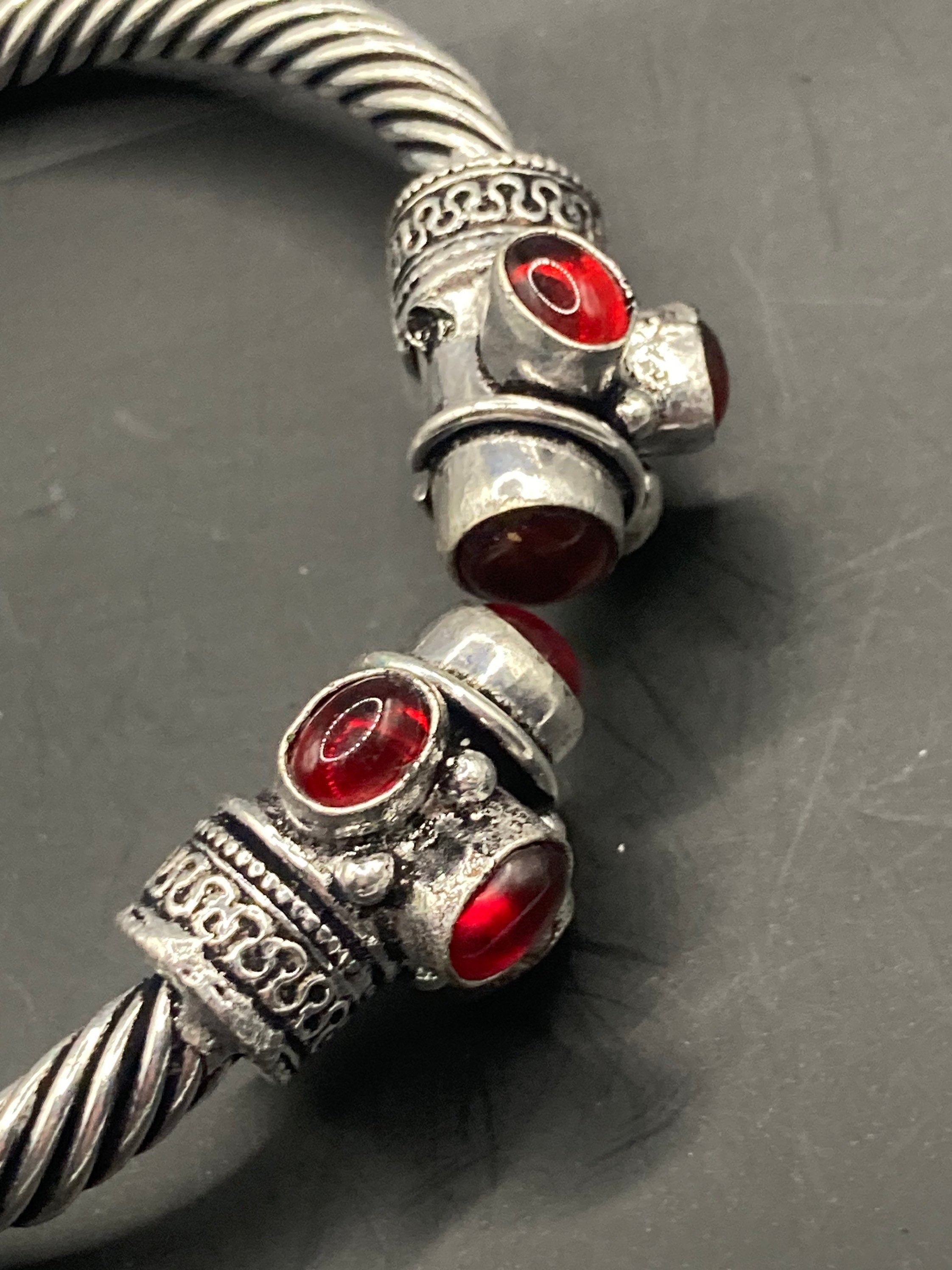 silver tone metal torque cuff bangle bracelet ruby red garnet glass stones